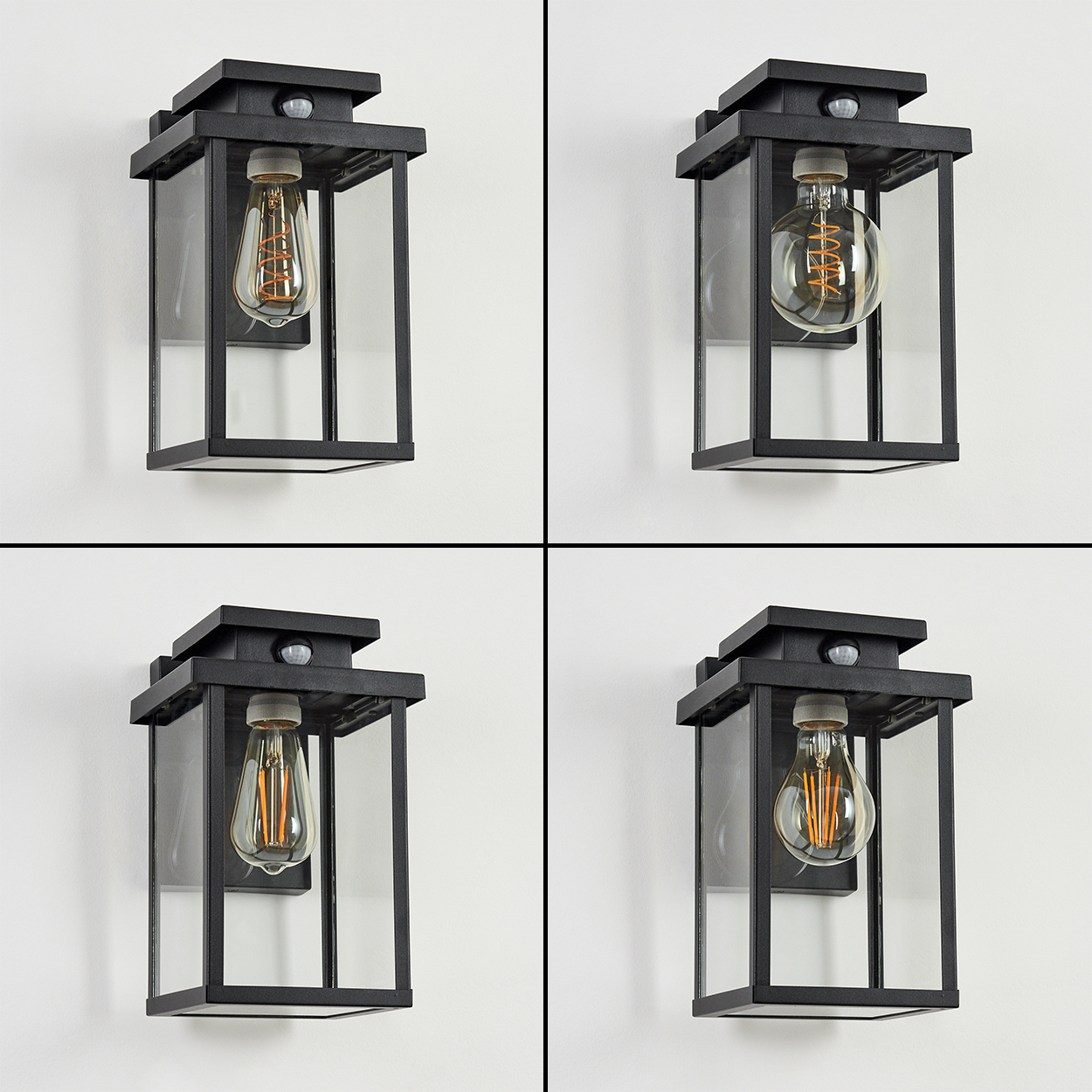 Vier schwarze Außenlampen mit Glaspaneelen und Edison-Glühbirnen vor einer weißen Wand. Jede hat einen Bewegungssensor.