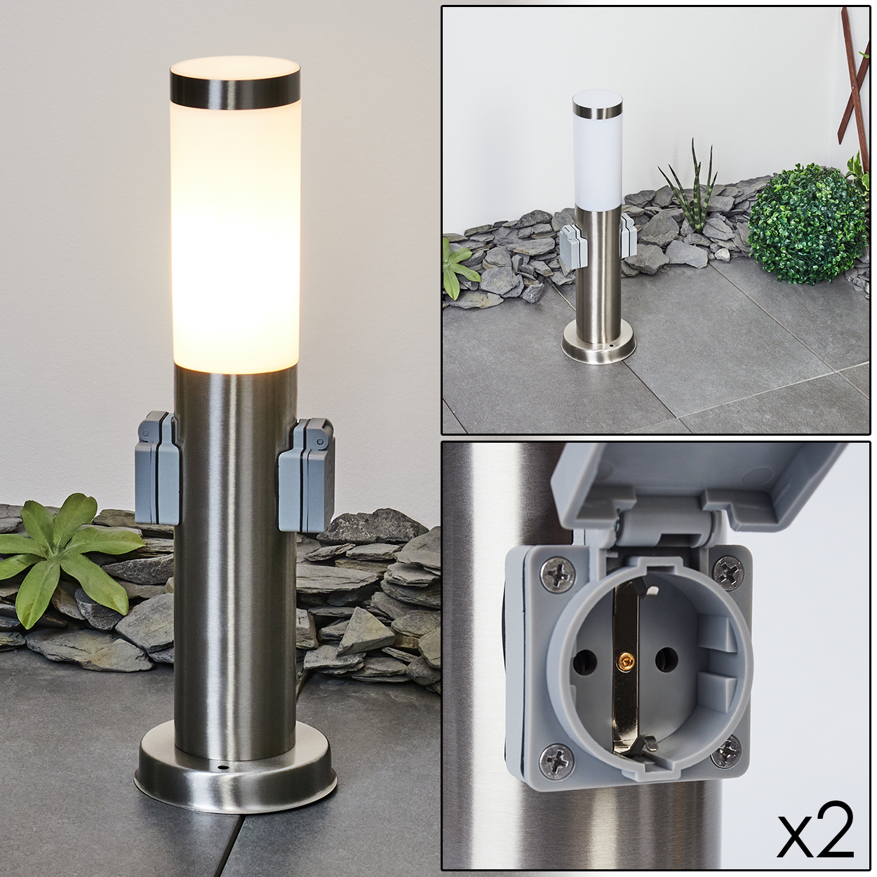 Eine silberne Außenlampe mit leuchtend weißem Oberteil und zwei grauen Steckdosen. Der Hintergrund zeigt eine Steinmauer und eine grüne Pflanze.