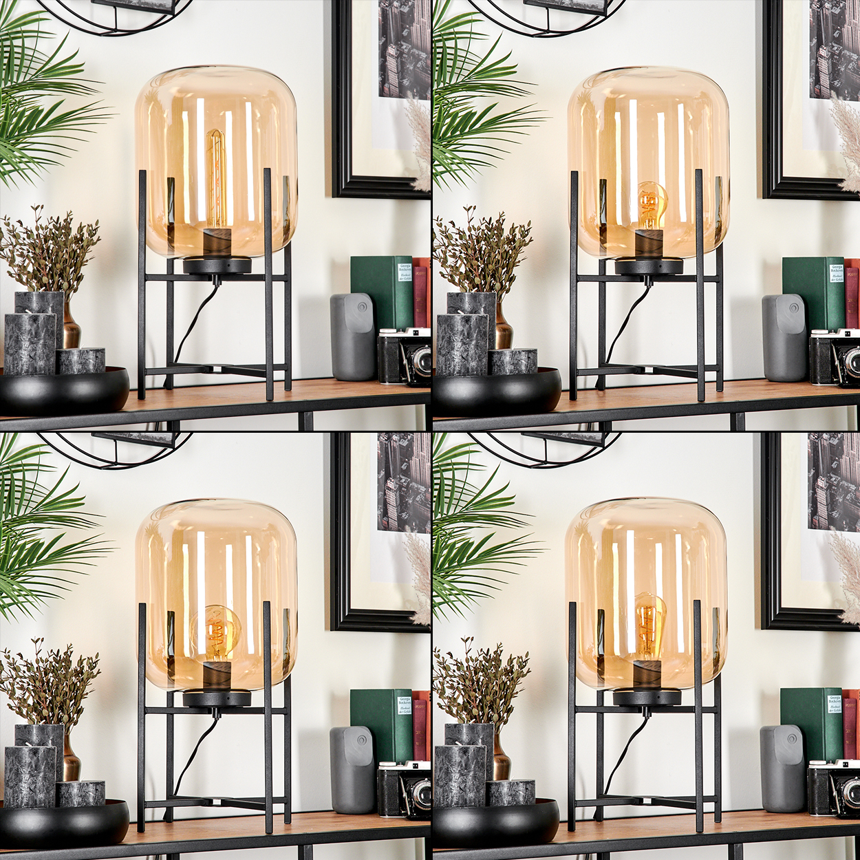Eine Lampe mit bernsteinfarbenem Glasschirm steht auf einem Regal mit Dekoration, Büchern und einer Kamera vor einer weißen Wand mit gerahmter Kunst.
