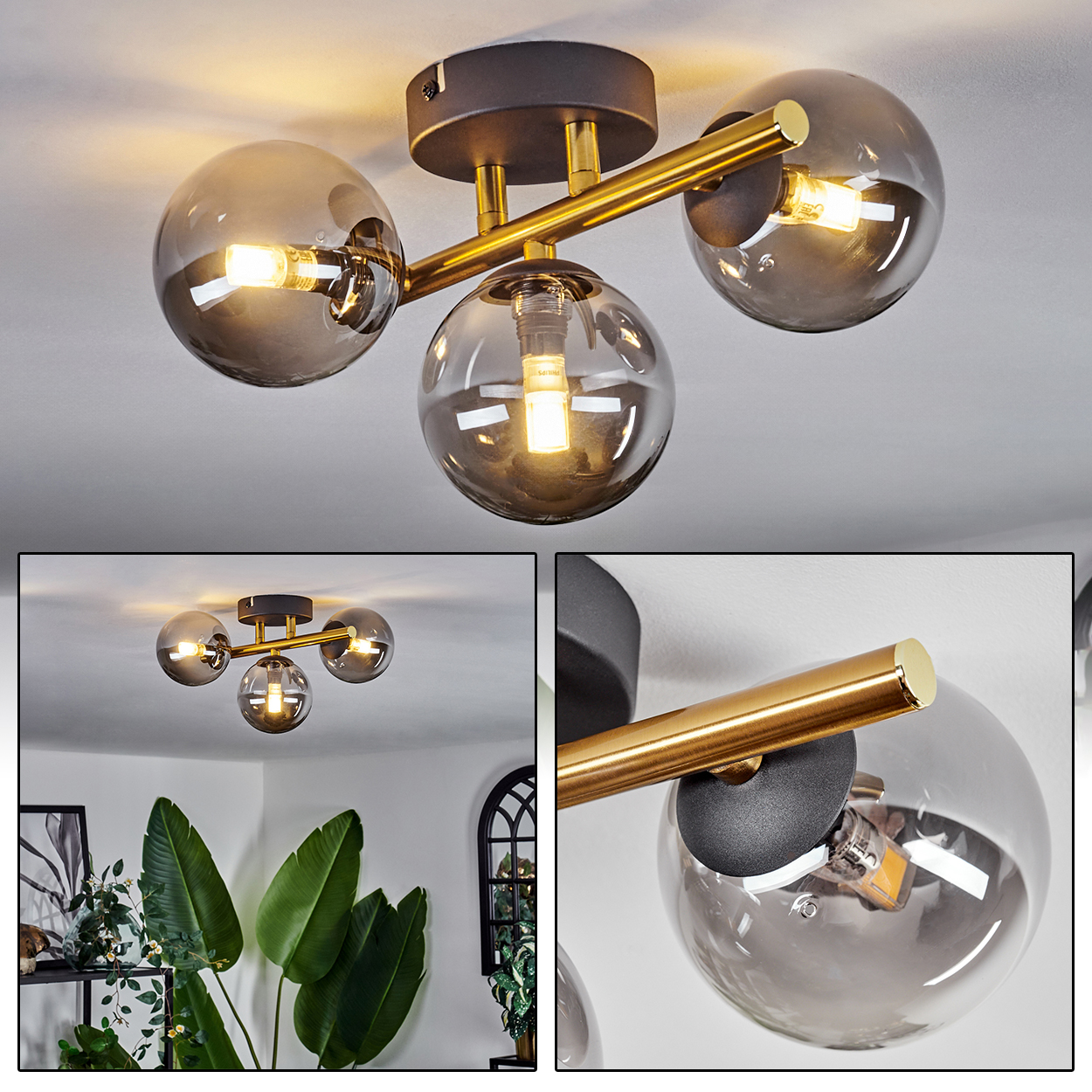 Eine Deckenlampe mit drei kugelförmigen, rauchfarbenen Glasschirmen. Die Leuchte hat goldfarbene Akzente und ist auf einem schwarzen Sockel montiert.
