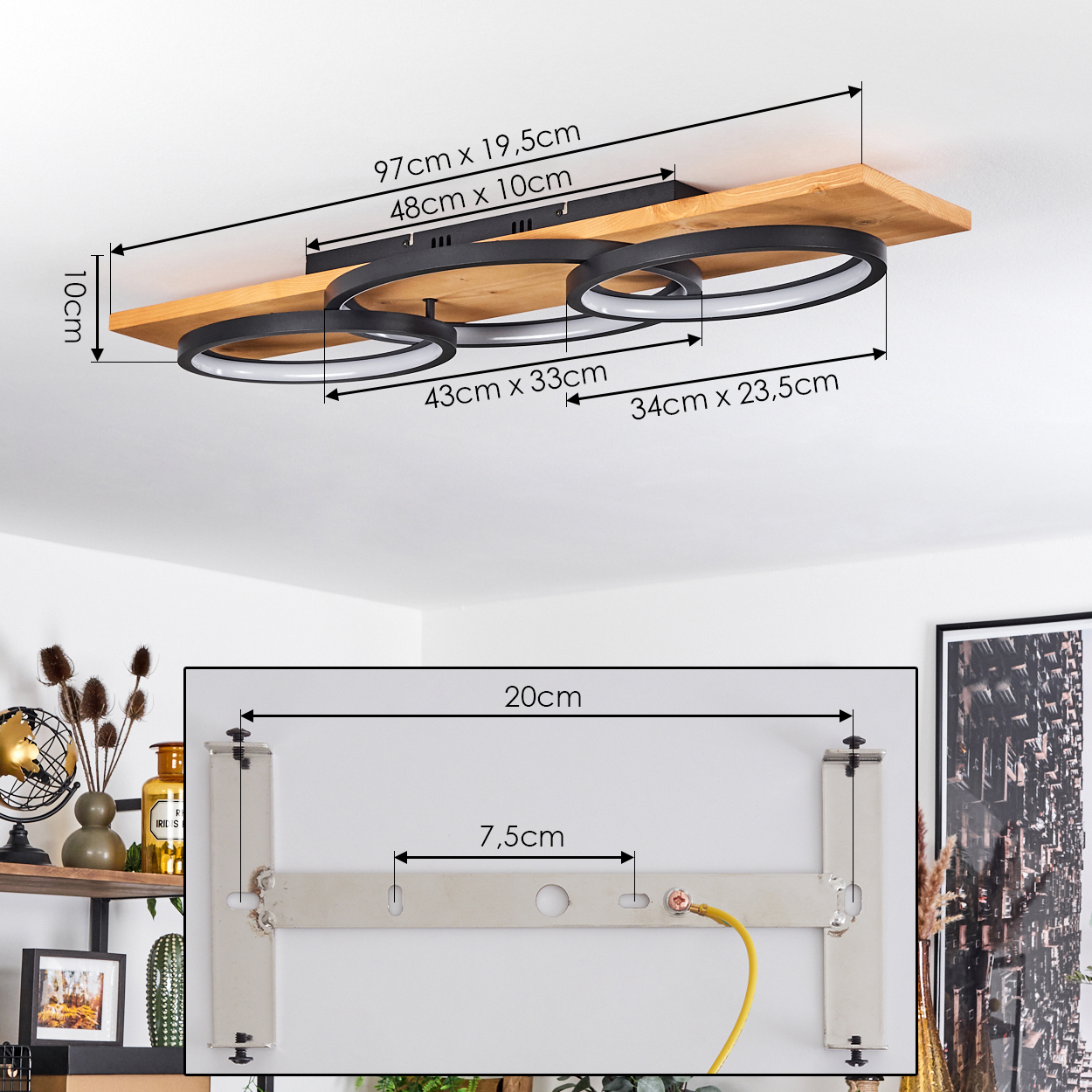Eine Deckenlampe aus Holz mit drei schwarzen, kreisförmigen Lichtern. Abmessungen sind angegeben. Eine Metallhalterung ist ebenfalls mit Maßen gezeigt.
