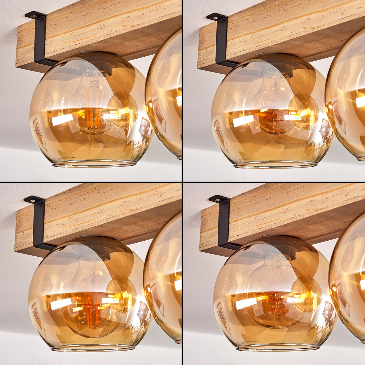 Nahaufnahme einer modernen Leuchte. Sie hat Holzbalken, schwarze Metallhalterungen und bernsteinfarbene Glaskugeln mit sichtbaren Glühbirnen.