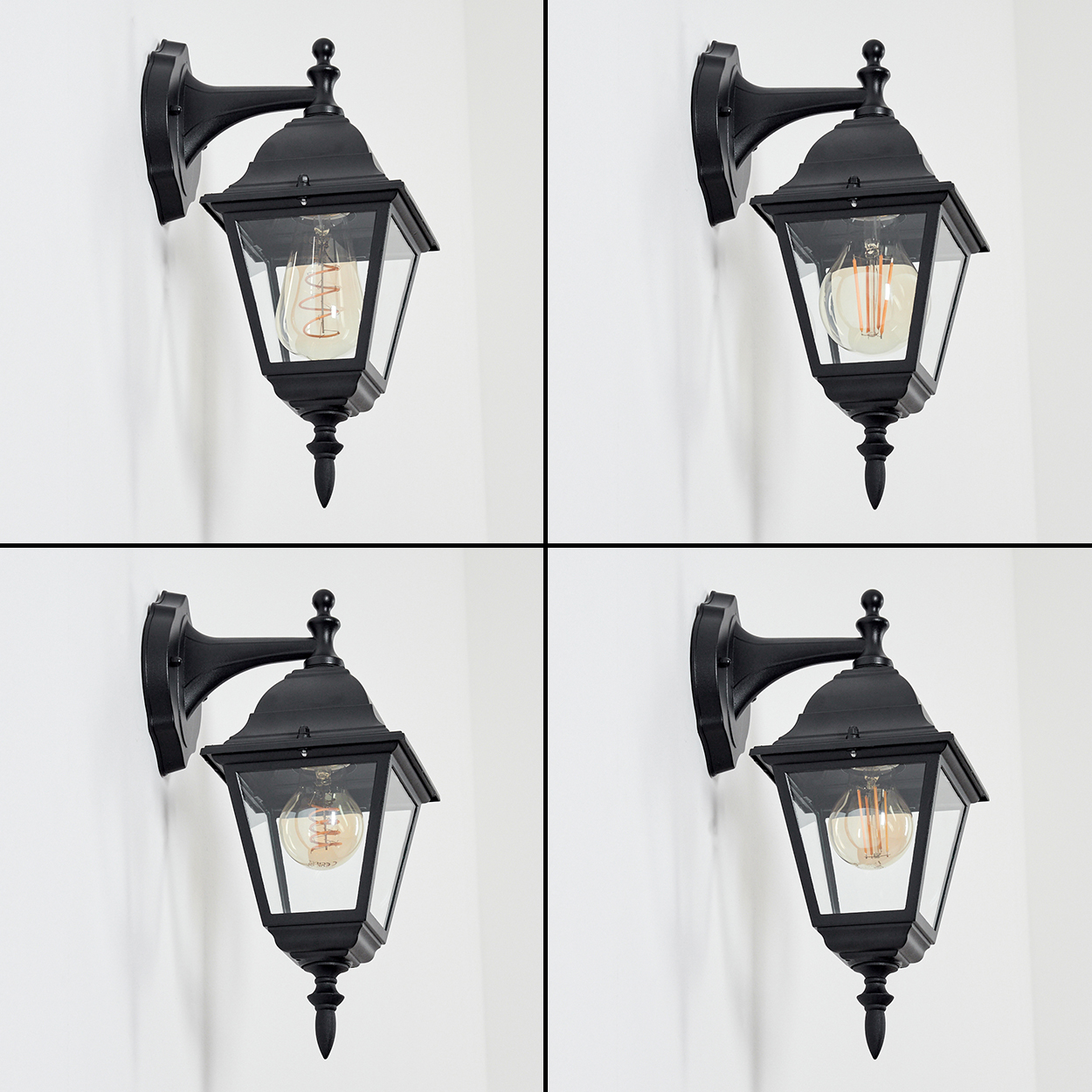Vier schwarze Wandlampen mit Glaspaneelen und Edison-Glühbirnen an einer weißen Wand.