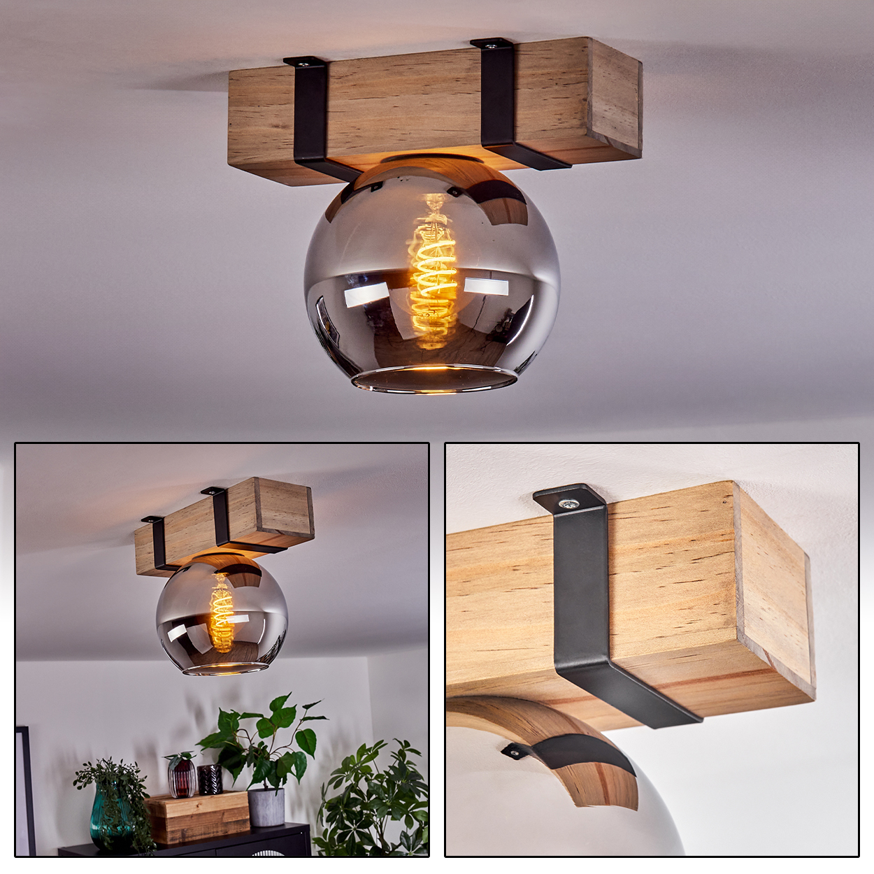 Eine Deckenlampe mit Holzbalken, schwarzen Metallhaltern und einer Glaskugel mit sichtbarer Glühbirne. Das Licht ist an.