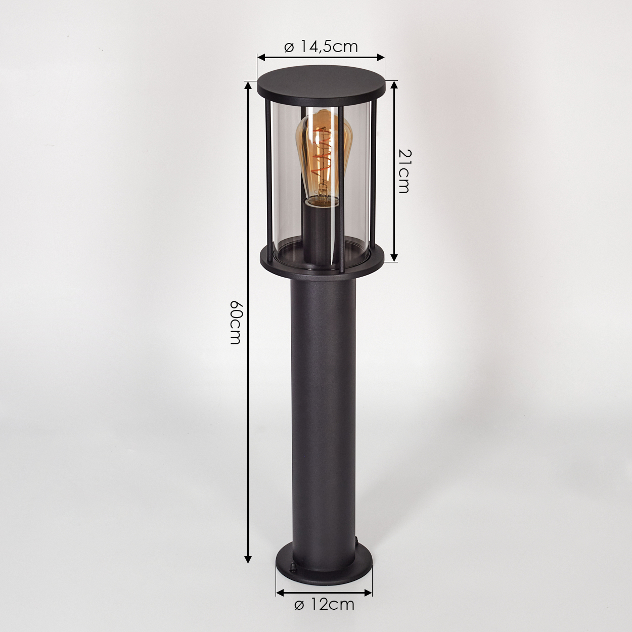 Schwarze Außenlampe mit Glaszylinder, eine Glühbirne im Inneren. Abmessungen: 60cm Höhe, 14,5cm oben, 12cm Basis.