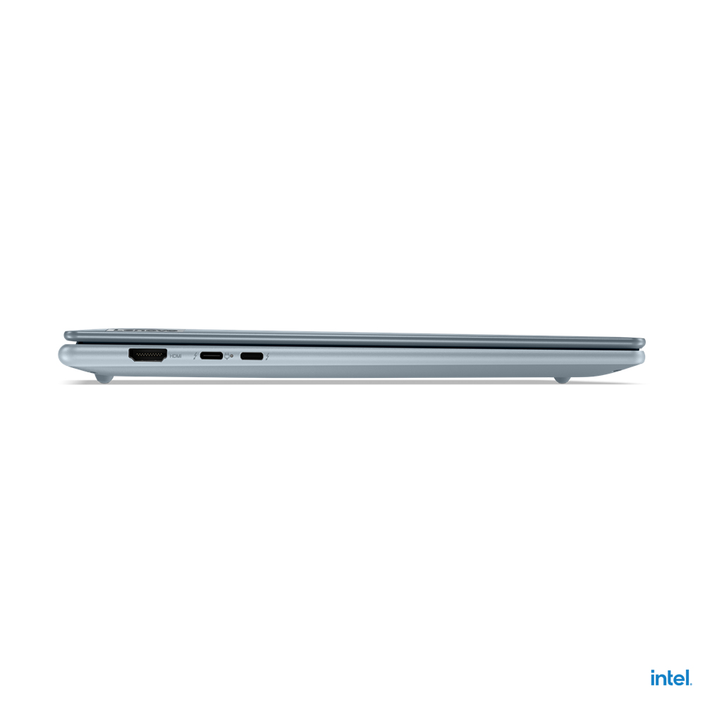 Vista laterale di un laptop blu. Le porte visibili includono HDMI, USB-C e alimentazione. Lo schermo è chiuso. Lo sfondo è bianco.