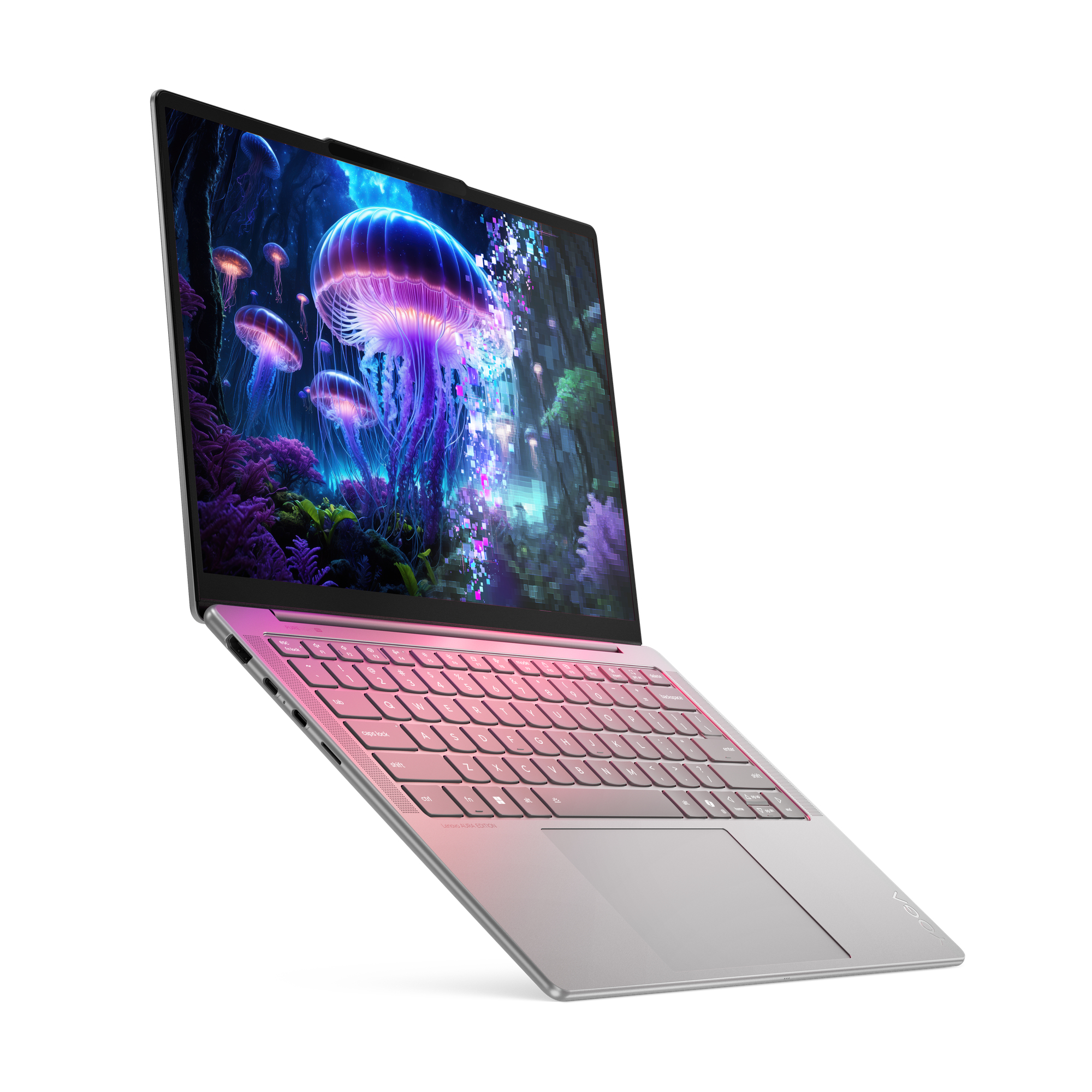 Laptop con schermo di meduse. La tastiera ha una sfumatura rosa-grigio. Lo sfondo è bianco.
