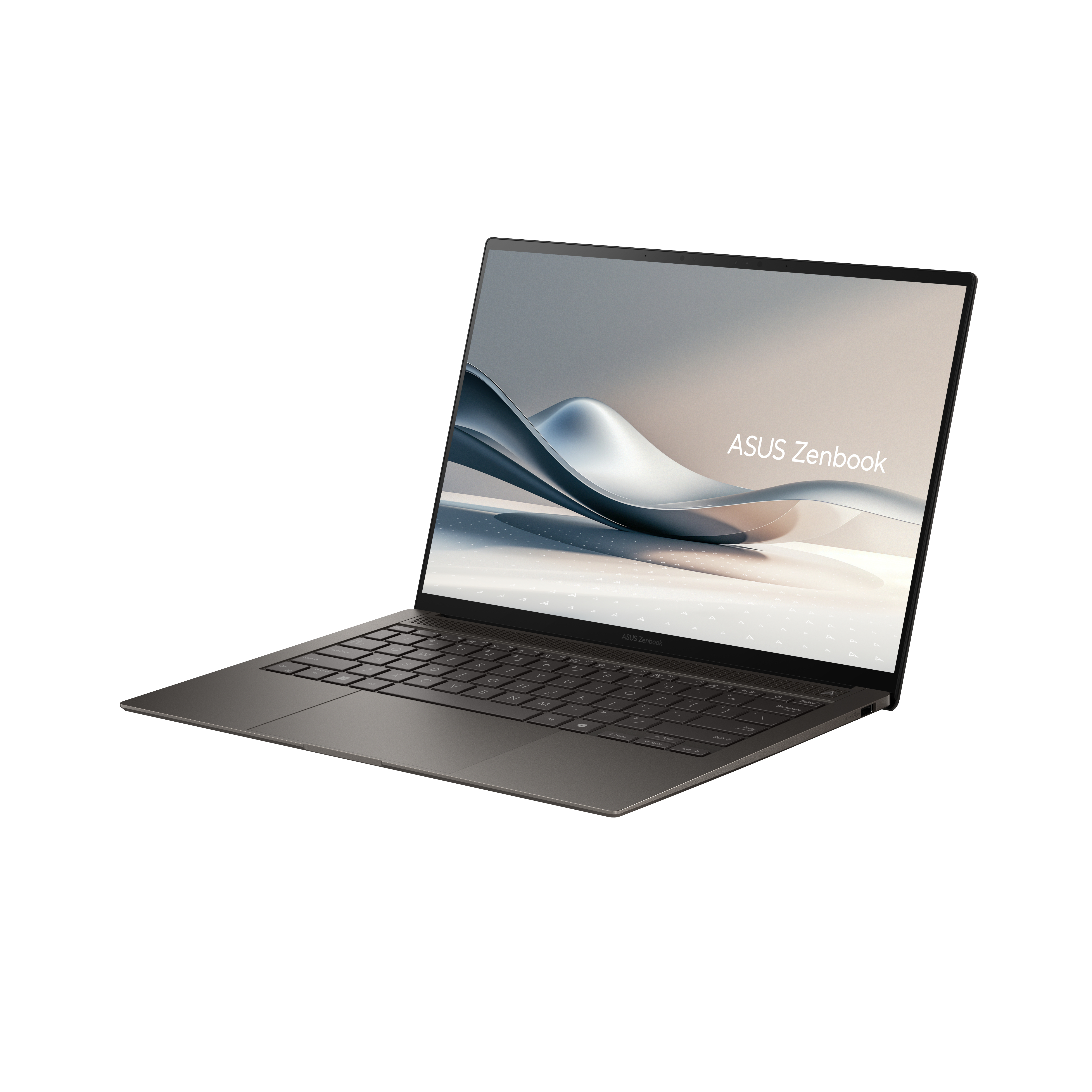 A silver ASUS Zenbook laptop is on a white background. The screen shows a wave-like graphic and the brand name.