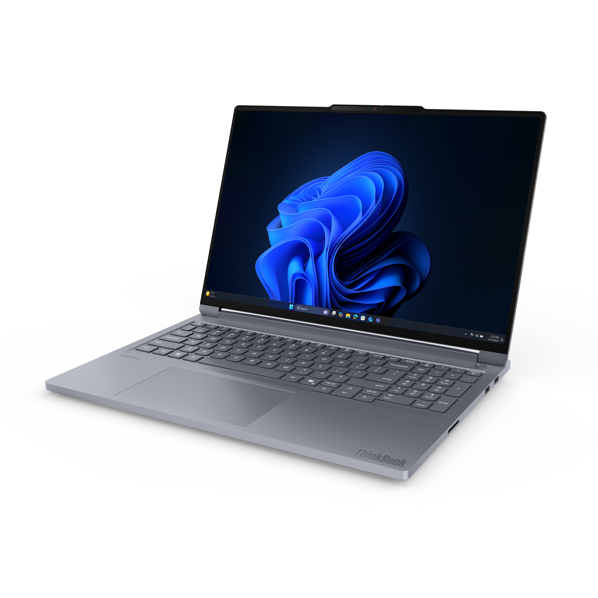 Szary laptop ThinkBook jest otwarty, wyświetlając niebieskie tło Windows 11. Znajduje się na białej powierzchni.