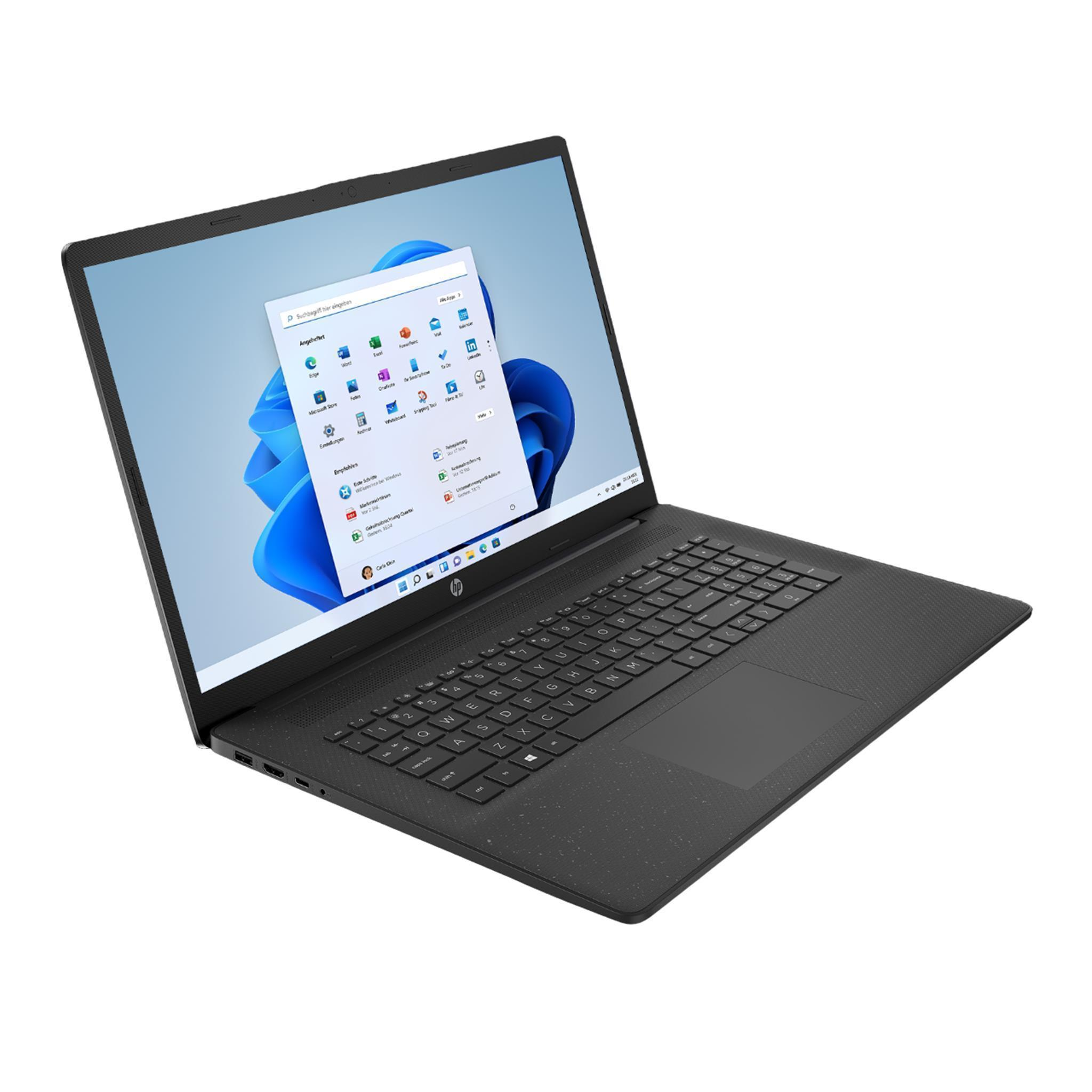Ein schwarzer Laptop mit geöffneter Windows 11-Oberfläche. Die Tastatur ist sichtbar. Der Bildschirm zeigt App-Symbole und das Startmenü.