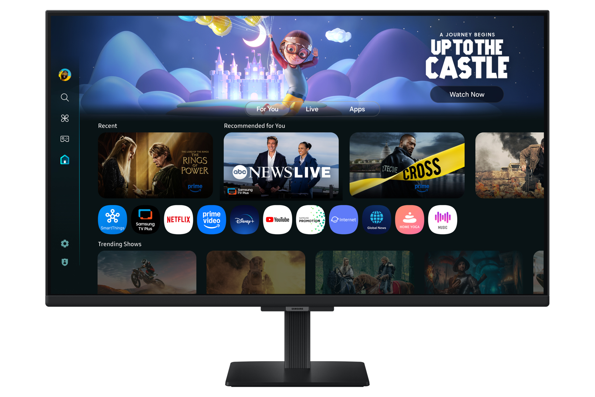 Uno schermo TV intelligente Samsung mostra icone di app e programmi. Un personaggio dei cartoni animati fluttua sopra un castello. Le app includono Netflix e Prime Video.