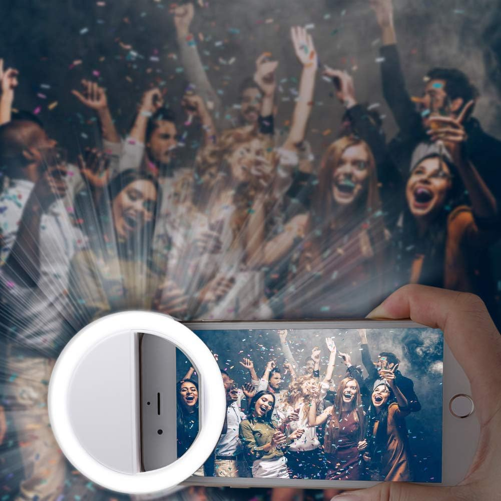 Auf einem Telefon wird eine Partyszene mit feiernden Menschen angezeigt. Ein Ringlicht ist angebracht. Konfetti fällt. Der Hintergrund ist unscharf.