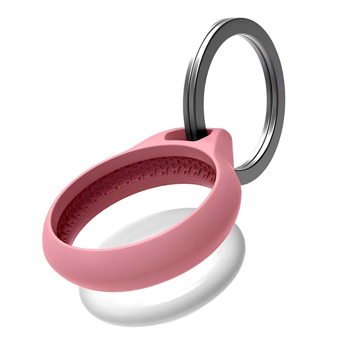 Un oggetto rosa a forma di anello con un portachiavi argentato attaccato, sopra un oggetto bianco e ovale. Lo sfondo è bianco.