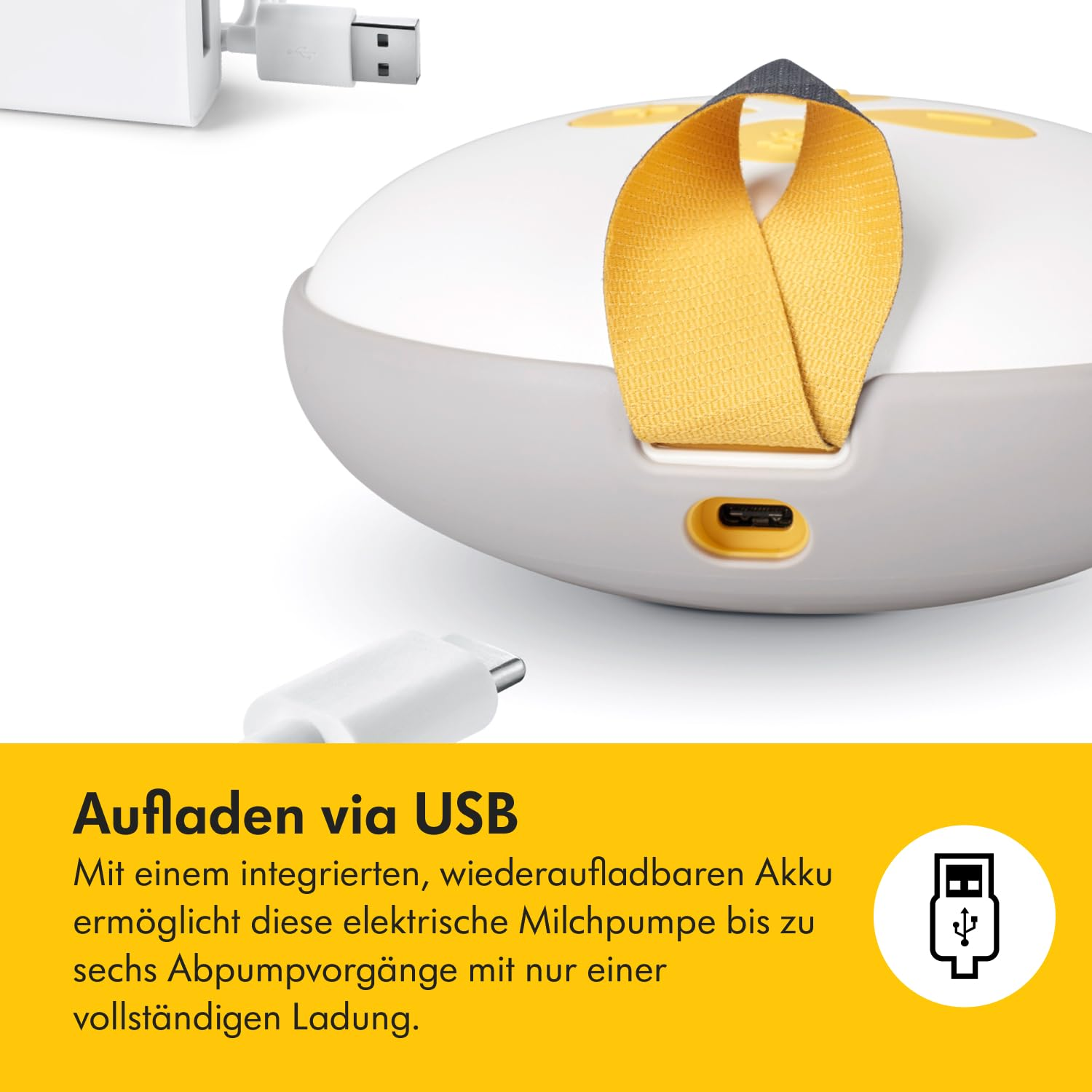 Eine weiße Brustpumpe mit gelbem Riemen, ein USB-Kabel und ein Ladegerät. Text: Aufladen über USB.