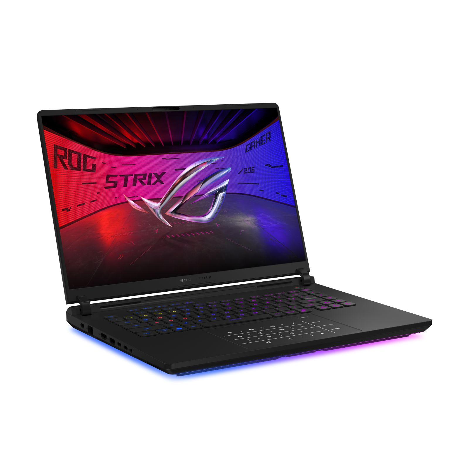 Czarny laptop z podświetlaną klawiaturą. Ekran pokazuje czerwoną i niebieską grafikę. Widoczne logo ROG Strix.