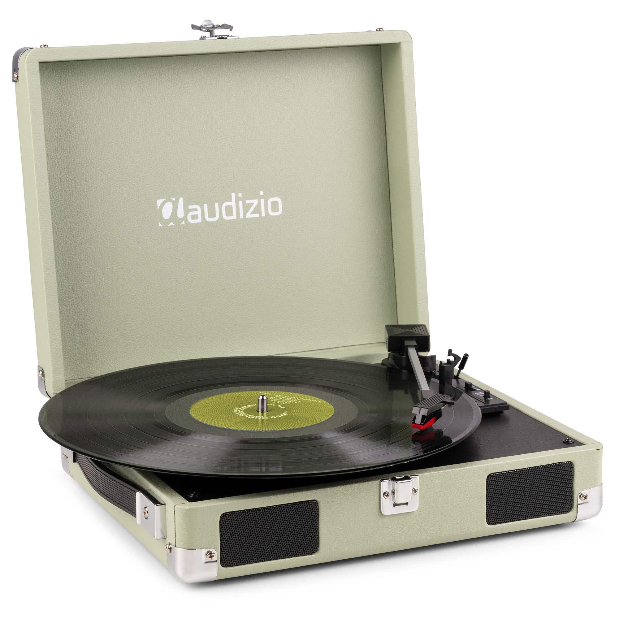 A light green Audizio record player is open, displaying a black vinyl record. The player has a silver clasp and speaker.