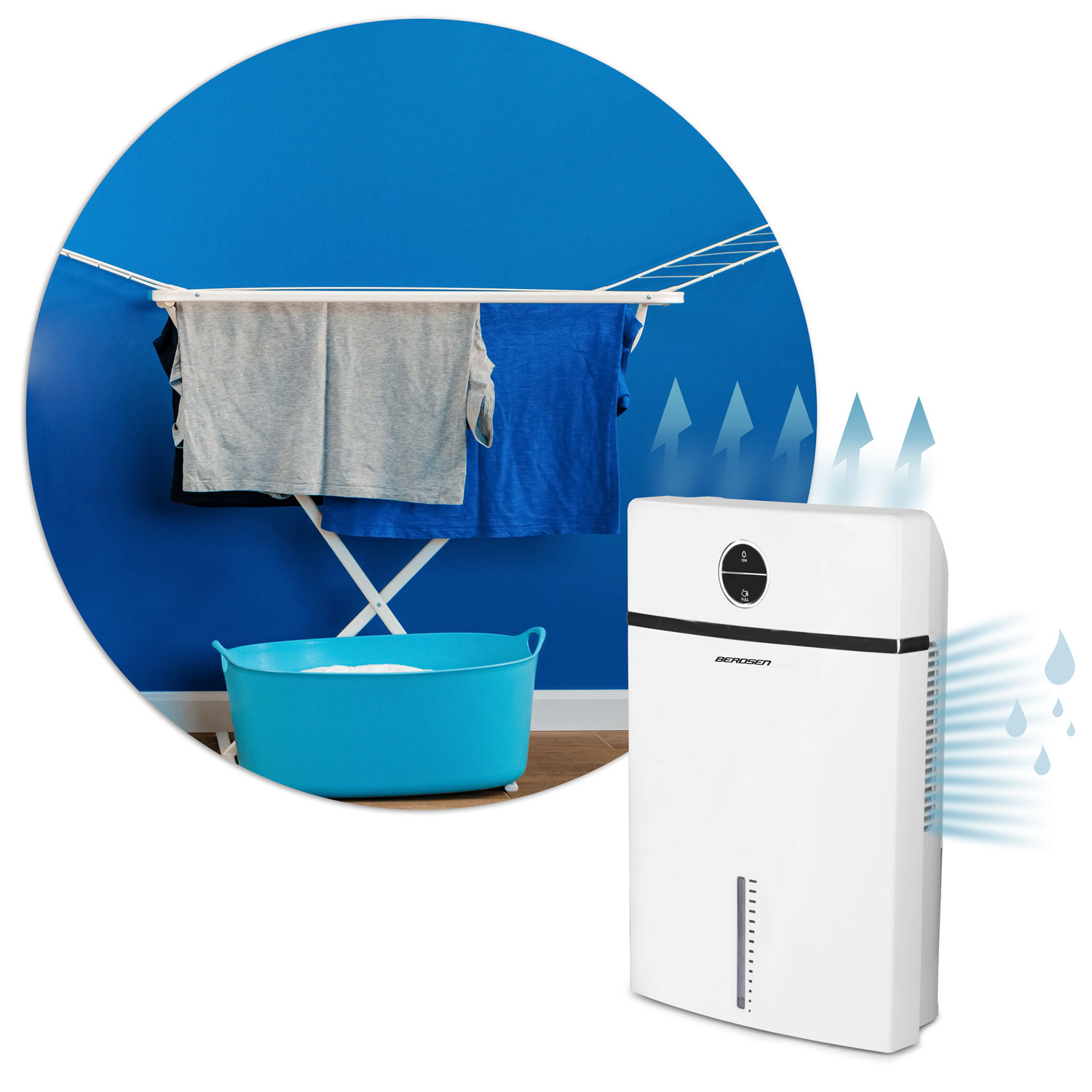Ubrania wiszą na stojaku przed niebieską ścianą. Biały osuszacz po prawej, z kroplami wody i strzałkami.