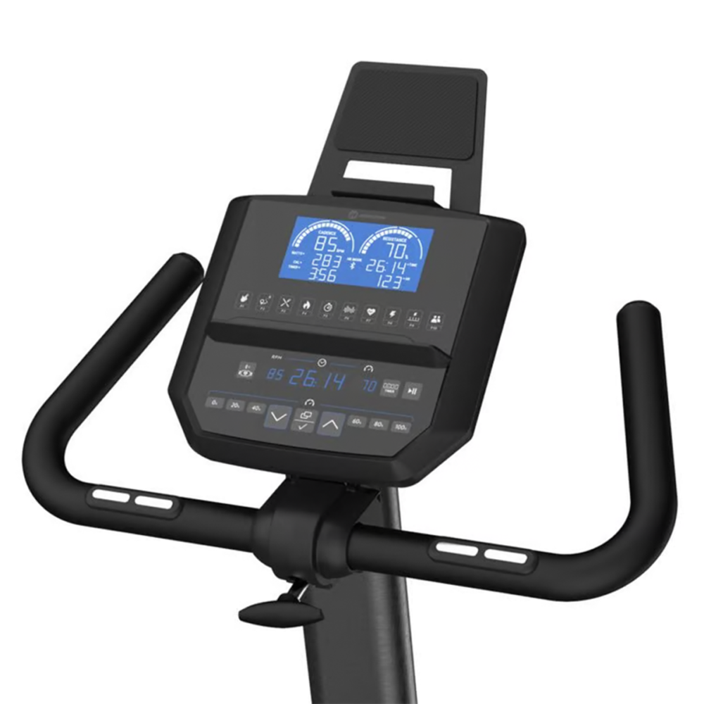 Vélo d'exercice stationnaire avec affichage numérique des statistiques, guidon noir et support de téléphone en haut.