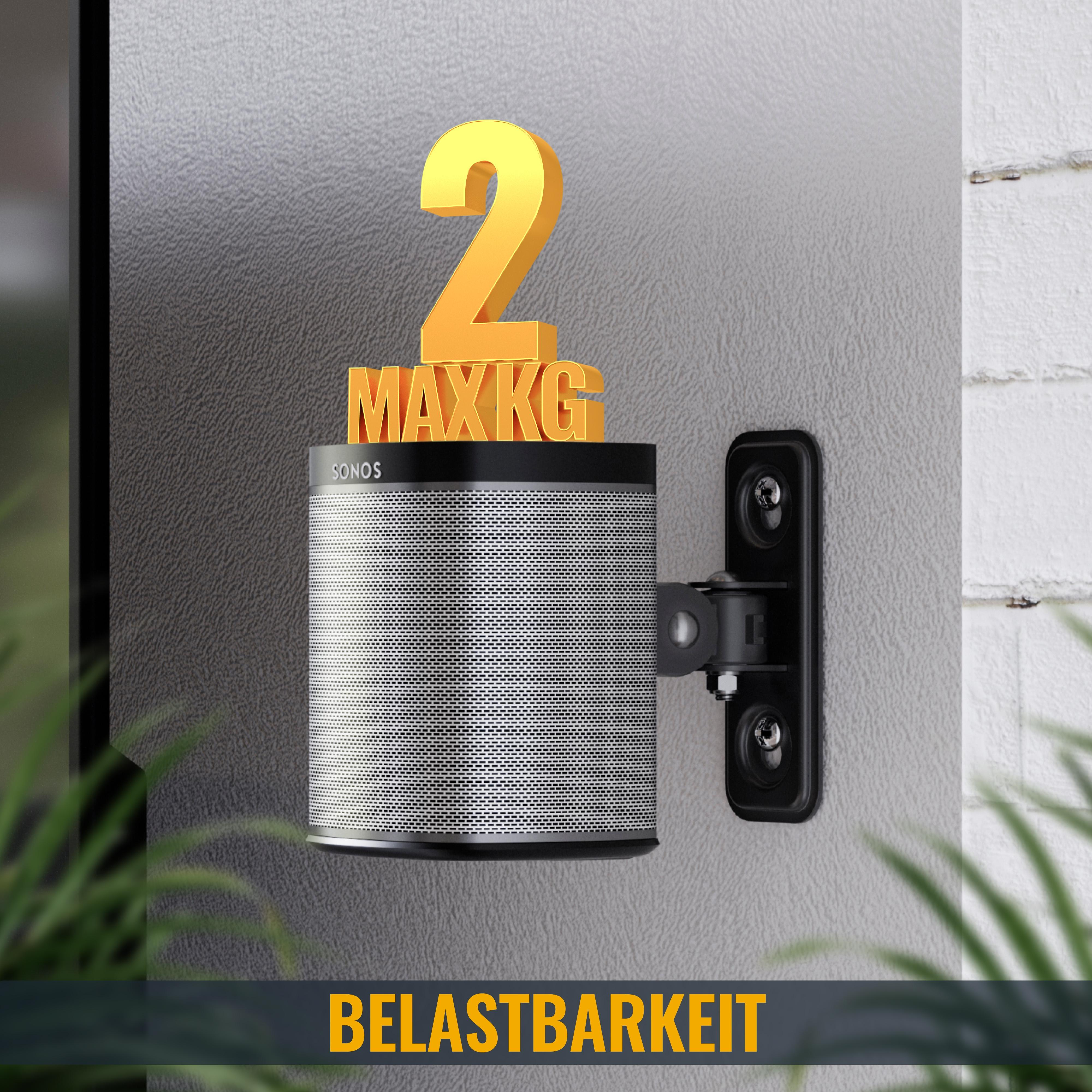 Ein schwarzer Lautsprecher an der Wand. Goldener Text '2 MAX KG' darüber. Das Wort 'BELASTBARKEIT' darunter.