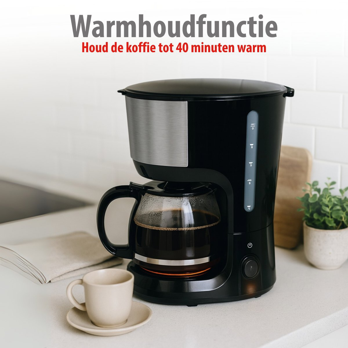 A black coffee maker with a glass carafe filled with coffee sits on a white counter. A cup and saucer are in the foreground.