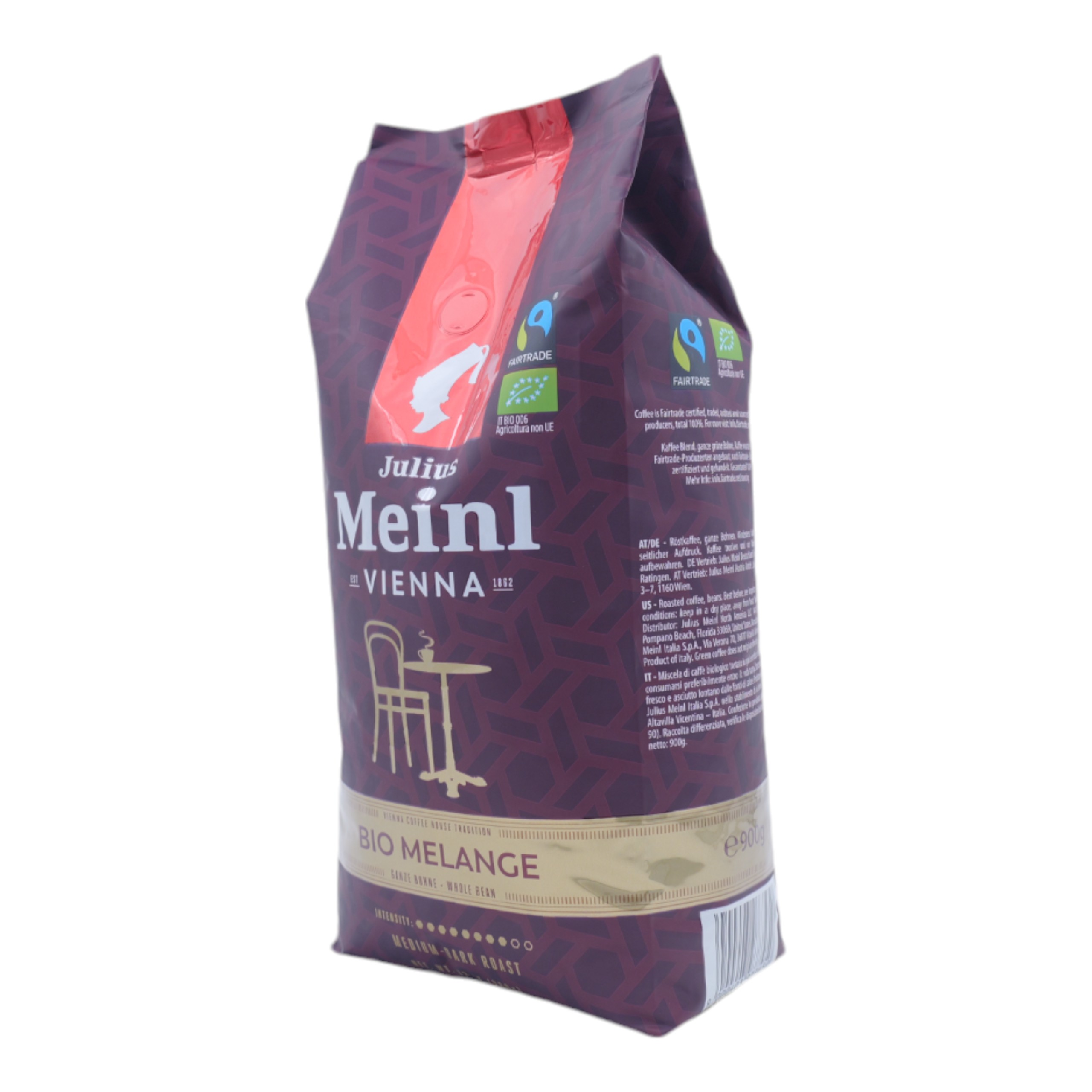 Un sacchetto di caffè con la parte superiore rossa e un motivo scuro. Ha etichette Julius Meinl Vienna e Fairtrade.