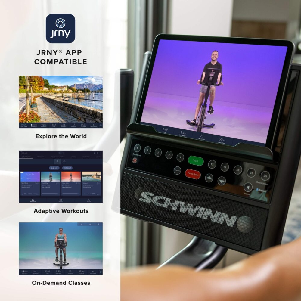 A stationary bike with a screen showing a person cycling. The screen displays workout data and the Schwinn logo is visible.