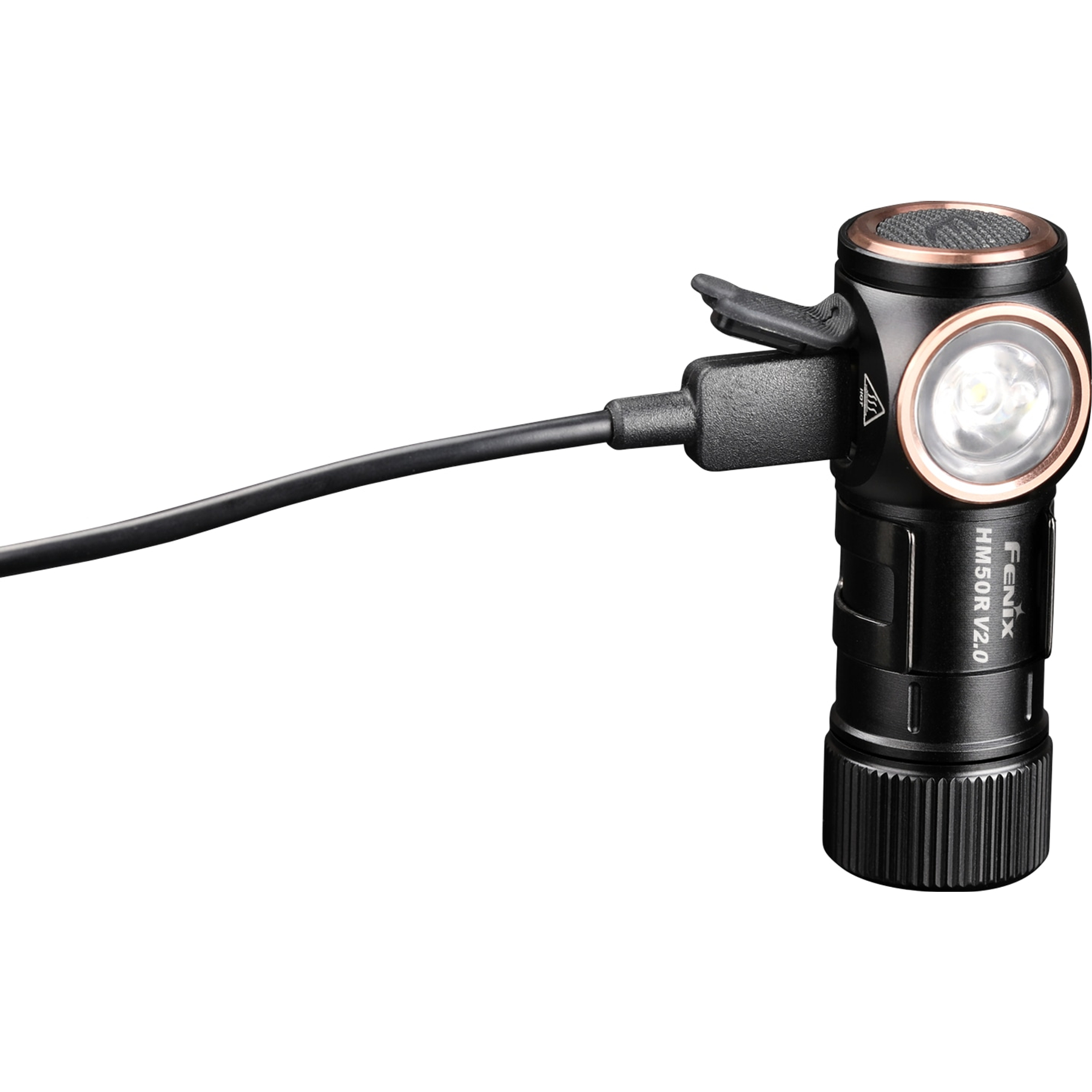 Lampe frontale Fenix HM50R V2.0 noire et cuivrée, se chargeant via un câble noir.