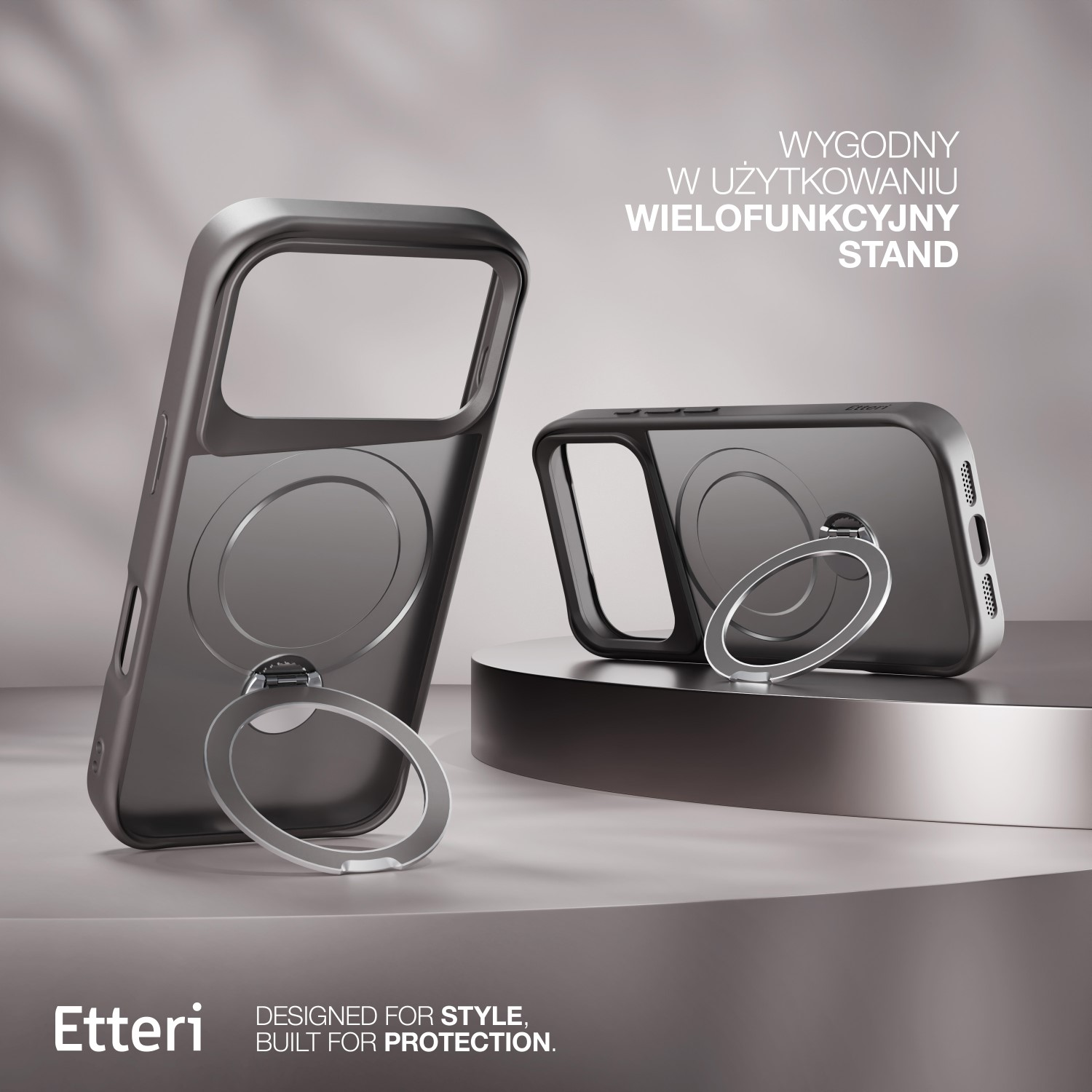 Due custodie per telefono grigio scuro con anelli di supporto. Una in posizione verticale, l'altra inclinata. Testo bianco: 'WYGODNY W UŻYTKOWANIU WIELOFUNKCYJNY STAND'.
