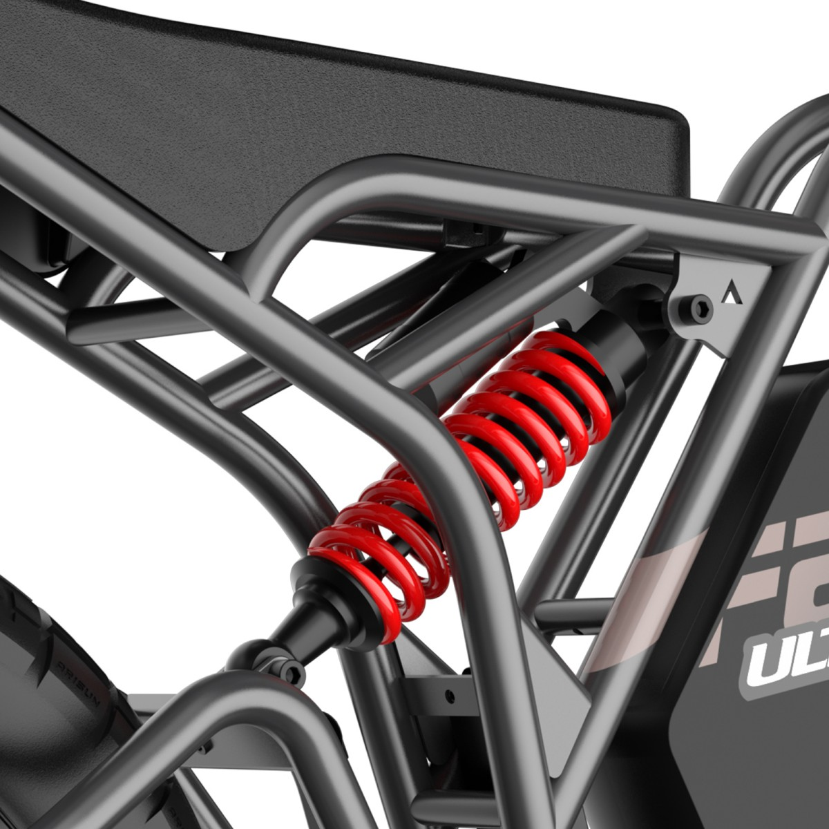 Zbliżenie na system zawieszenia roweru elektrycznego. Widoczna czerwona sprężyna, czarna rama i czarne siedzenie. Tło jest białe.