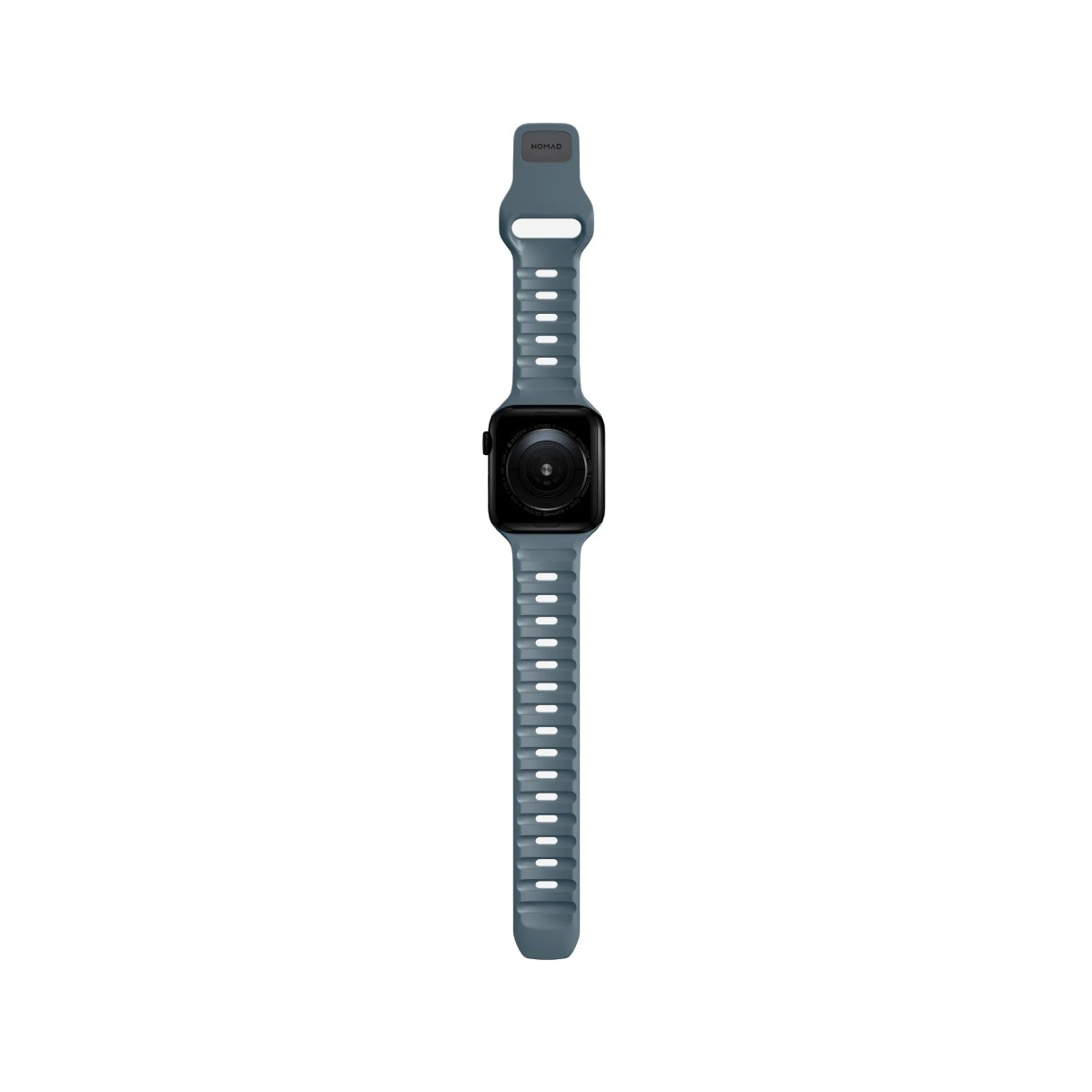 Un Apple Watch gris con pantalla negra y correa gris. Se ve la marca NOMAD.