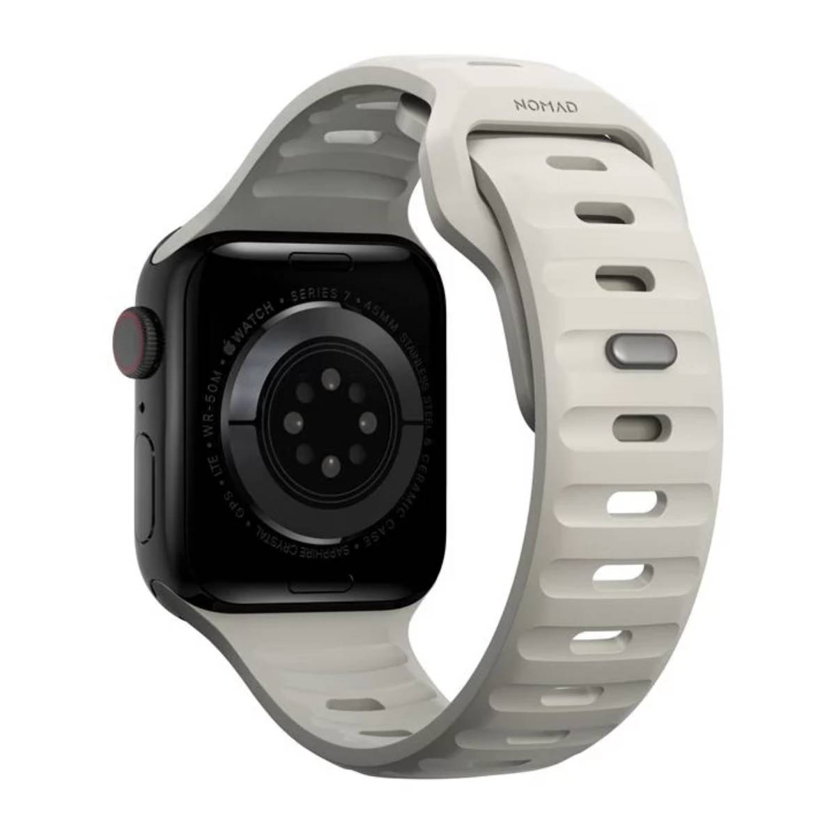 Apple Watch Series 7 con correa gris. La esfera del reloj es negra. La correa es gris claro con el logo 'NOMAD'.