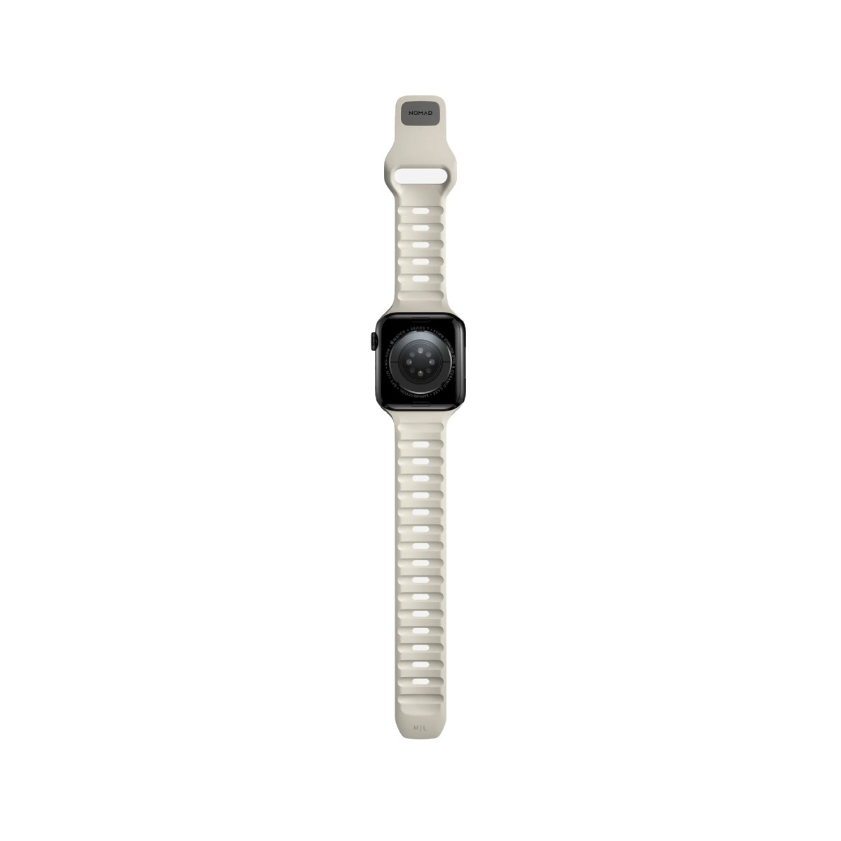 Un Apple Watch beige claro con pantalla negra, sobre fondo blanco. La correa dice NOMAD.