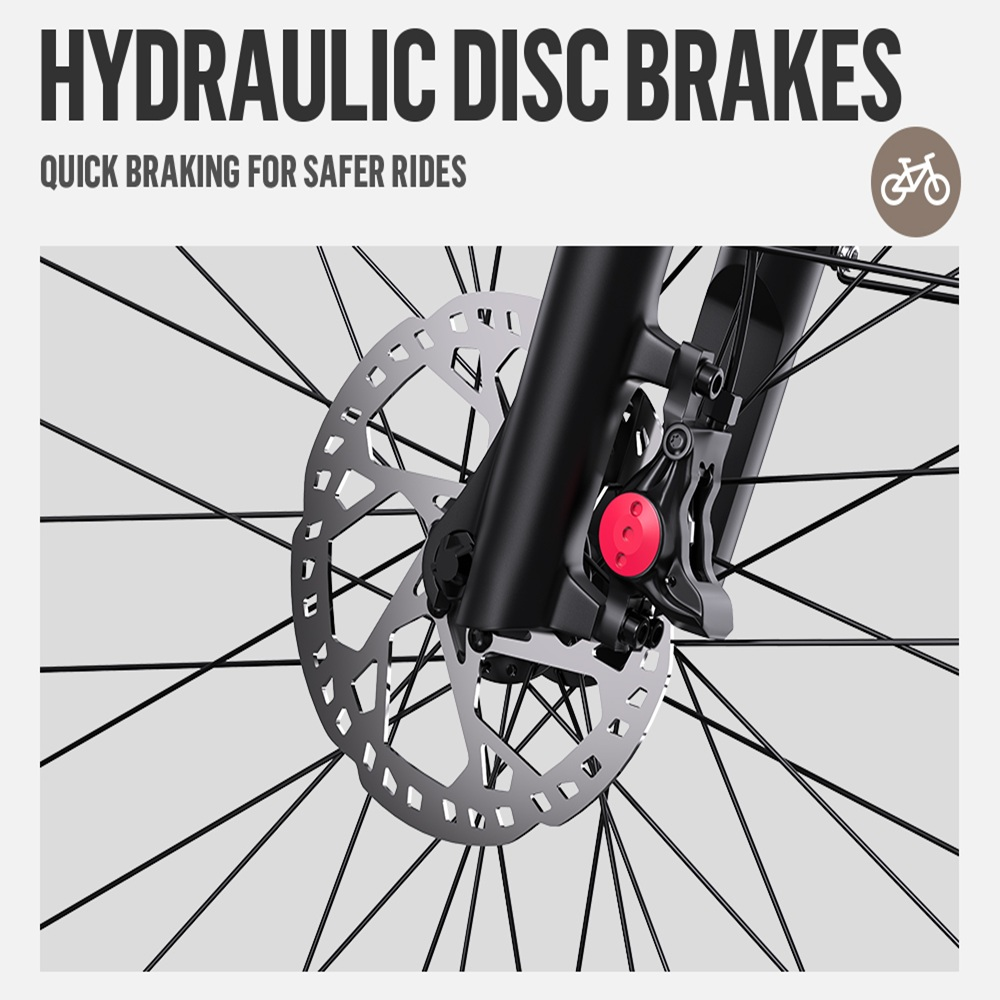 Primer plano del sistema de frenos de disco hidráulicos de una bicicleta. Se ven el disco rotor plateado y la pinza roja, junto con los radios y la horquilla negros.