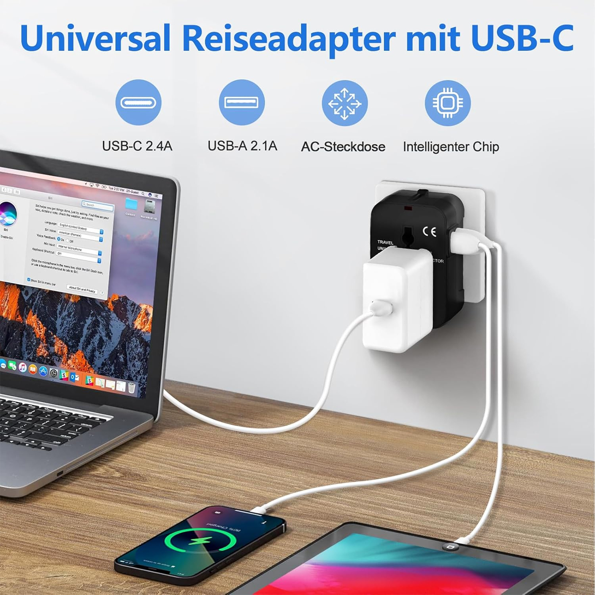 Ein Universal-Reiseadapter mit USB-C-Anschlüssen ist an eine Steckdose angeschlossen. Laptop, Telefon und Tablet werden geladen.