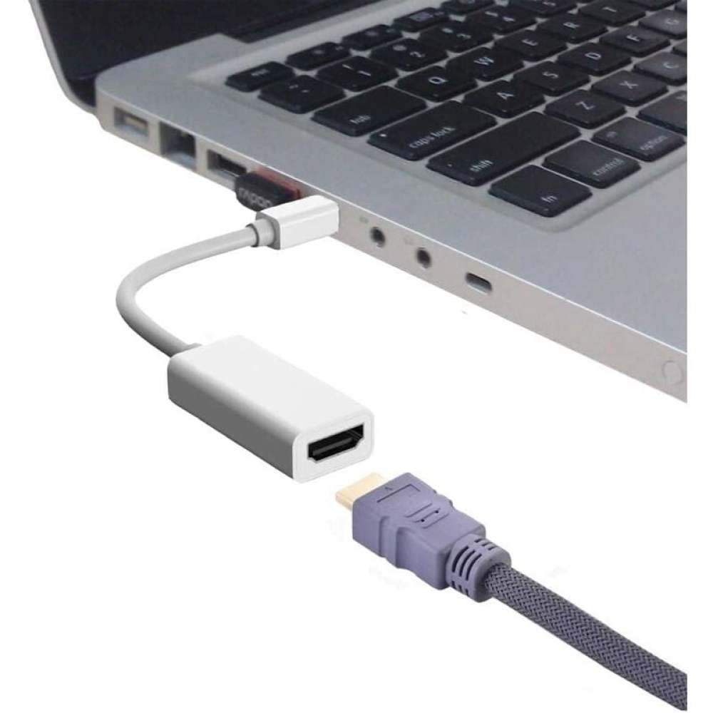 Laptop mit HDMI-Kabel verbunden. Ein weißer Adapter und ein graues HDMI-Kabel sind mit dem Laptop verbunden.