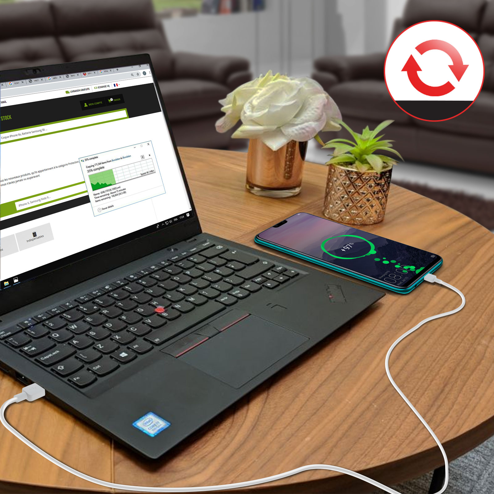 Ordenador portátil y teléfono conectados por cable en una mesa de madera. También se ve una flor, una planta y un icono de carga.