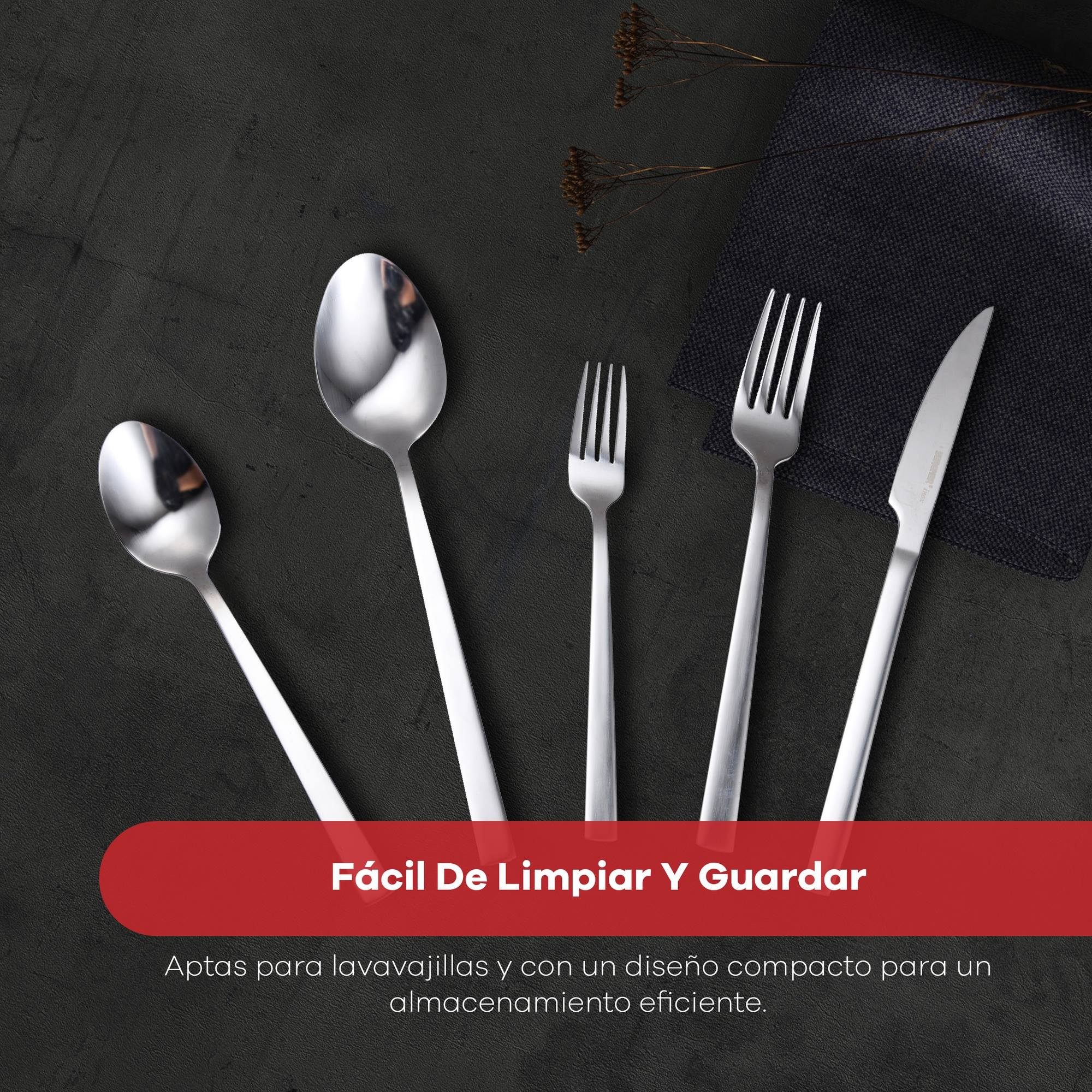Juego de cubiertos sobre una superficie oscura. Incluye cucharas, tenedores y un cuchillo. El texto dice: Fácil de limpiar y guardar.