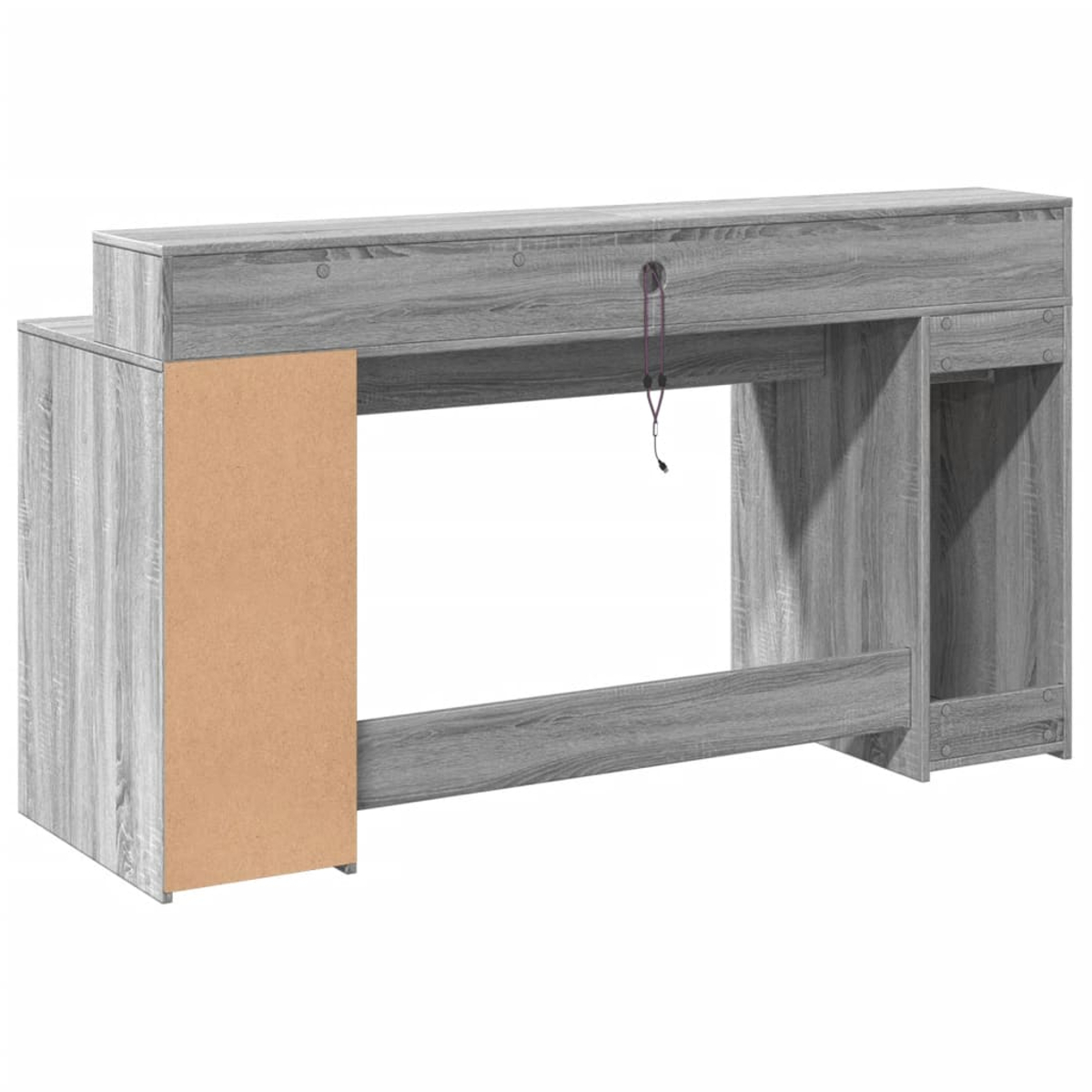 Ein grauer Computertisch aus Holz. Er hat eine hellbraune Seite und ein Loch für Kabel. Ein lila Kabel hängt von oben herunter.