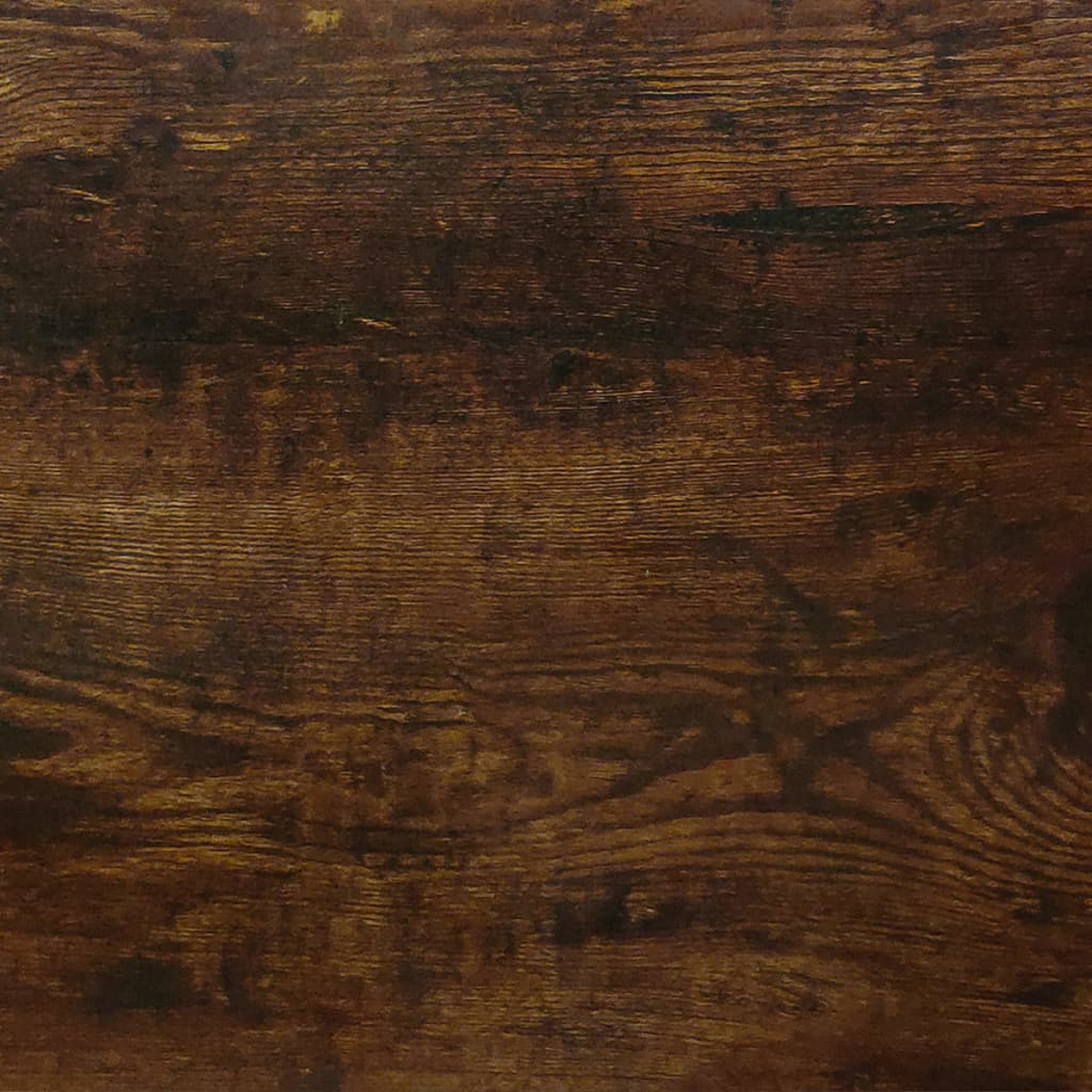 Nahaufnahme von dunkelbraunen Holzbrettern. Die Holzmaserung ist sichtbar, mit verschiedenen Brauntönen und natürlichen Texturen.
