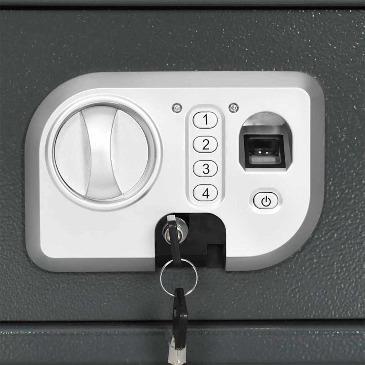 Nahaufnahme zeigt Bedienfeld eines Safes. Es hat ein Rad, Zifferntasten, Fingerabdruckscanner, Schlüsselloch und einen Ein-/Ausschalter.