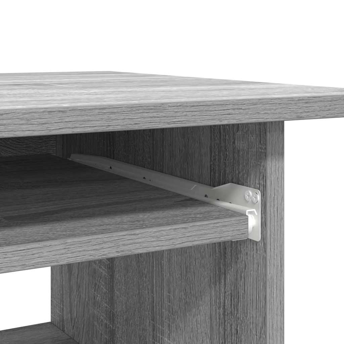 Nahaufnahme einer grauen Holztischecke mit sichtbarer Schubladenführung. Die Holzmaserung ist deutlich, die Führung weiß.