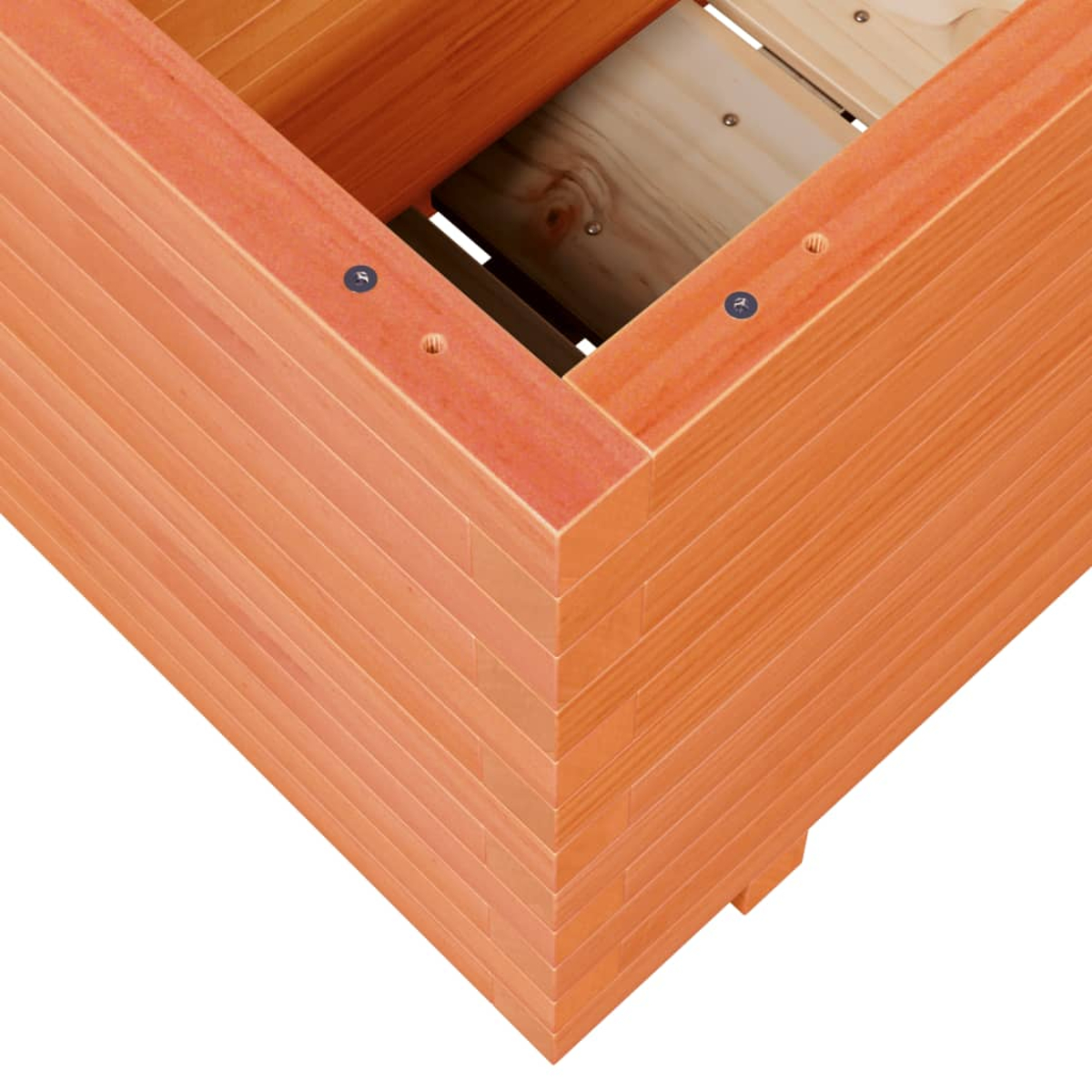 Nahaufnahme einer Ecke einer Holzpflanzkiste. Die Kiste ist orange-braun, mit sichtbarer Holzmaserung und Schrauben. Innen sind Holzlatten zu sehen.