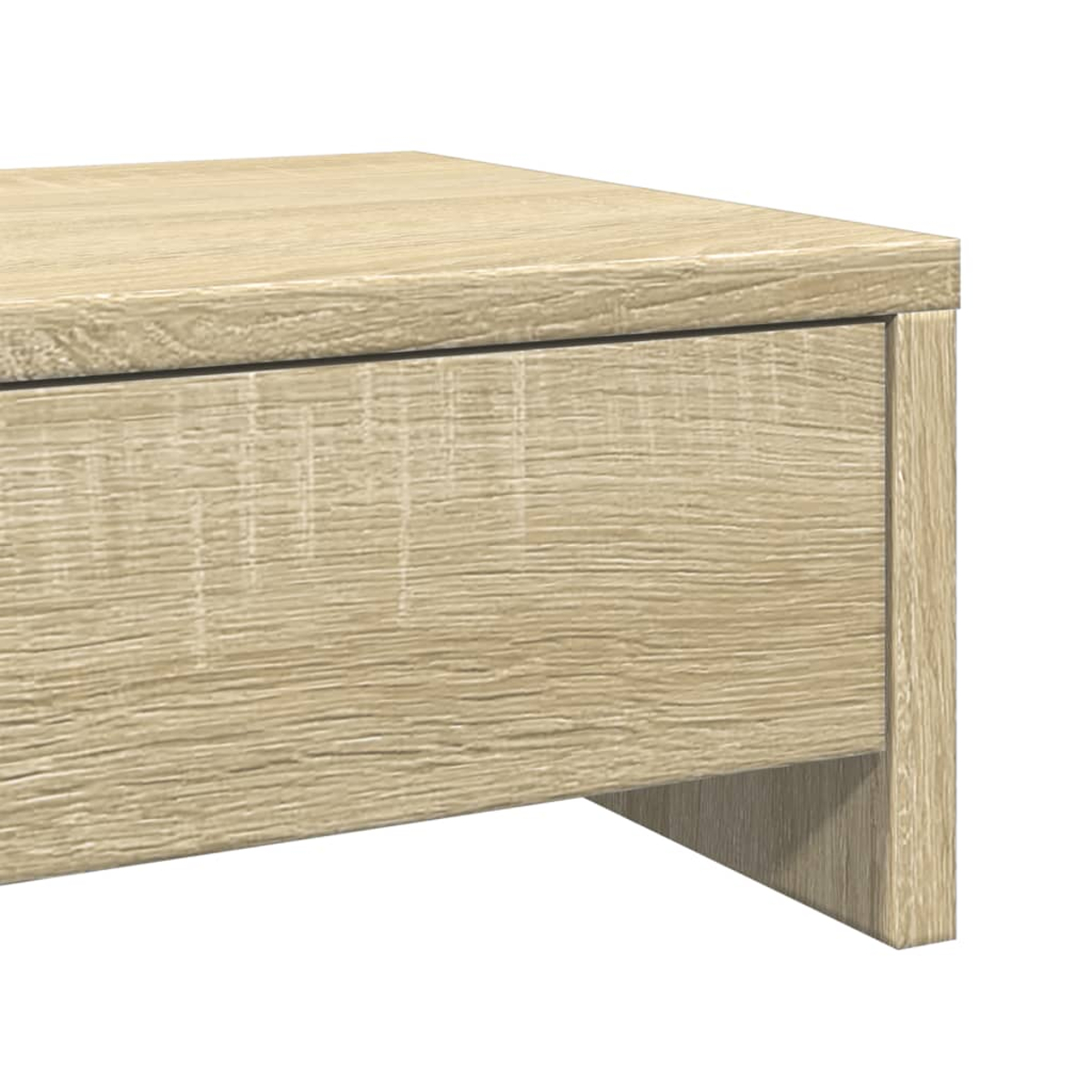 Nahaufnahme einer hellen Holztischecke. Der Tisch hat eine Schublade und ein Stützbein, alles in hellem Braun.
