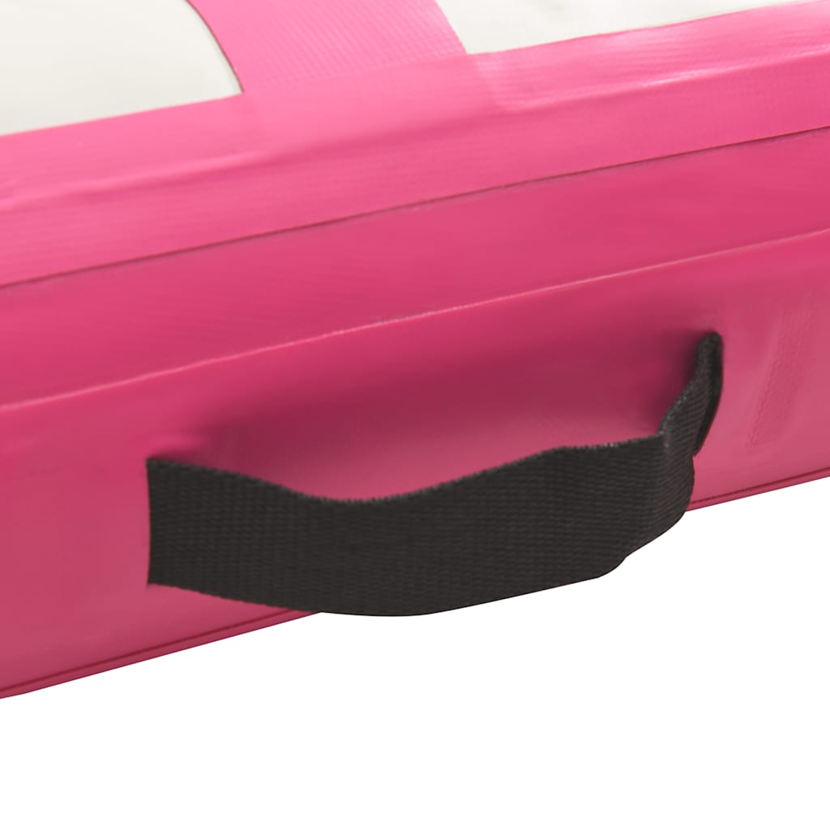 Nahaufnahme eines pinkfarbenen rechteckigen Objekts mit schwarzem Griff. Oben sind weiße und rosa Streifen zu sehen. Der Griff ist aus schwarzem Stoff.