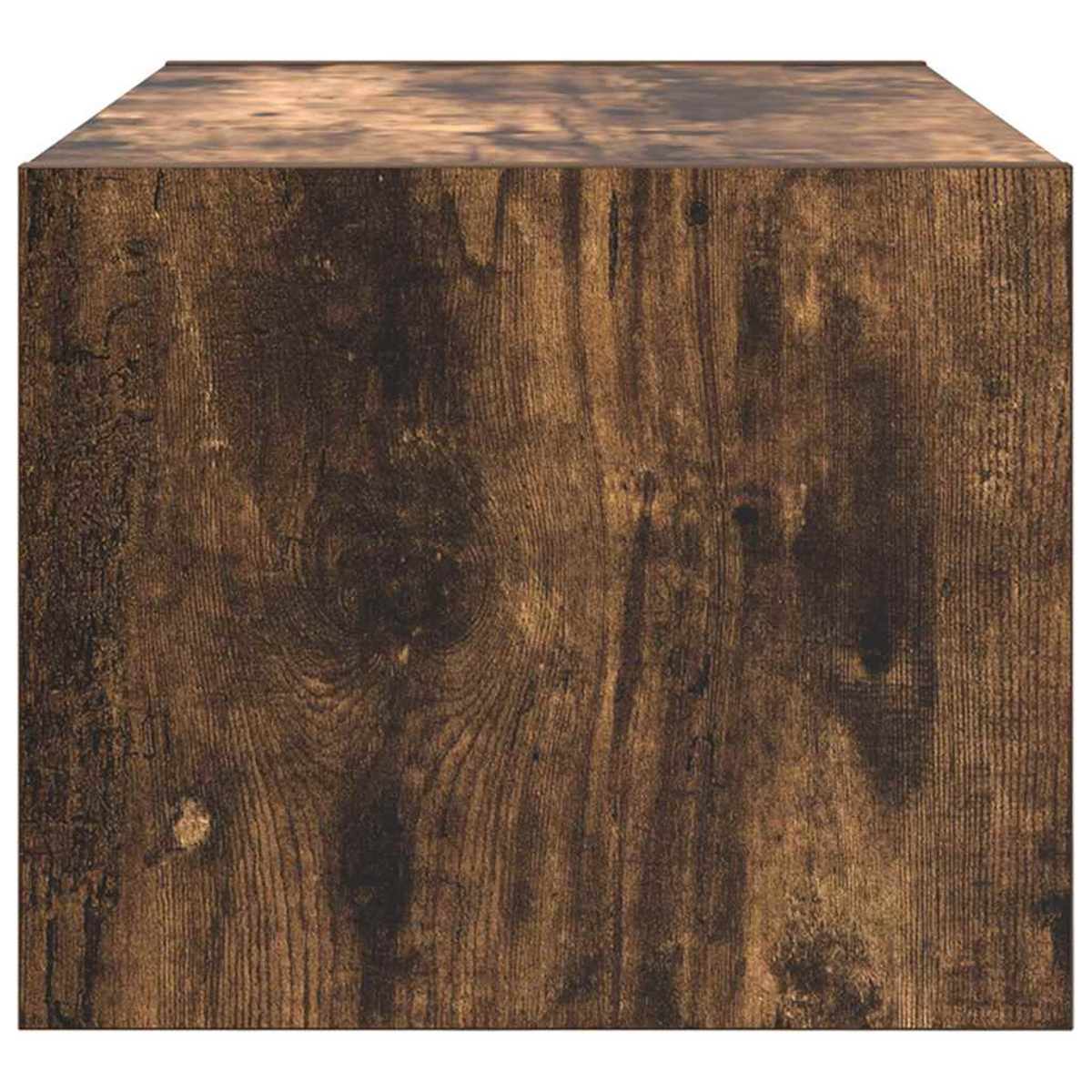 Nahaufnahme eines braunen Holzblocks. Die Maserung ist mit Knoten und dunkelbraunen Mustern auf allen Seiten sichtbar.