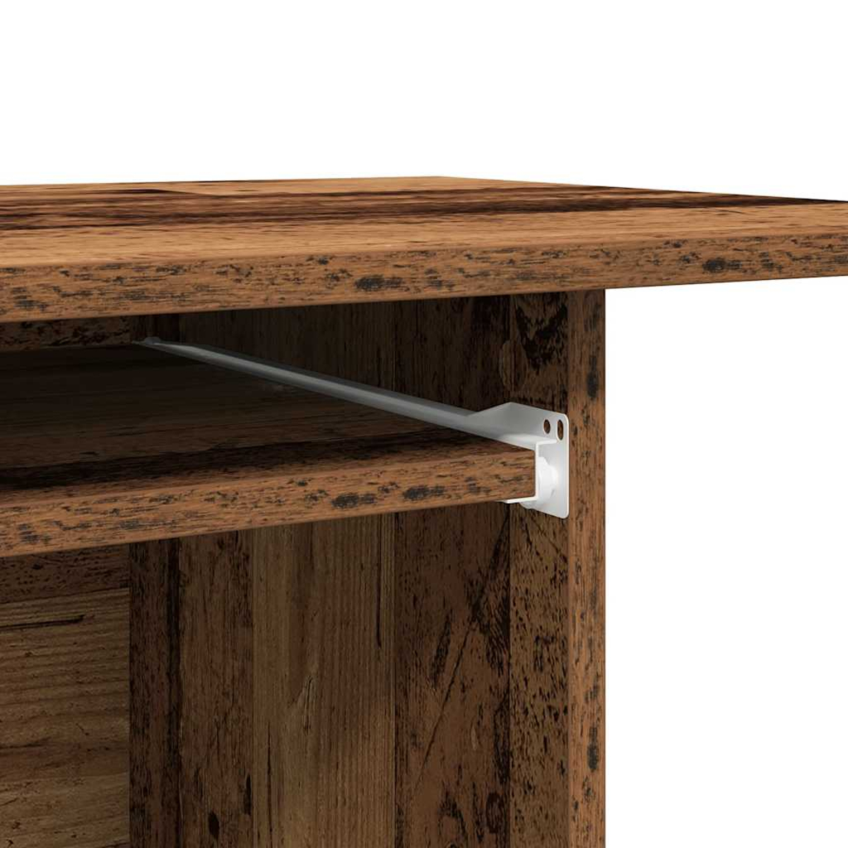 Nahaufnahme einer Holztischecke. Eine weiße Metallstütze befindet sich unter einem Regal. Das Holz ist braun mit sichtbarer Maserung.