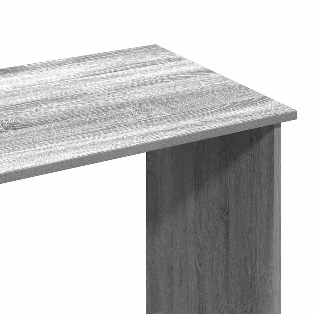 Nahaufnahme einer grauen Holztischecke. Die Tischplatte hat ein Holzmaserungsmuster. Die Seitenwand ist ebenfalls grau mit vertikalen Linien.
