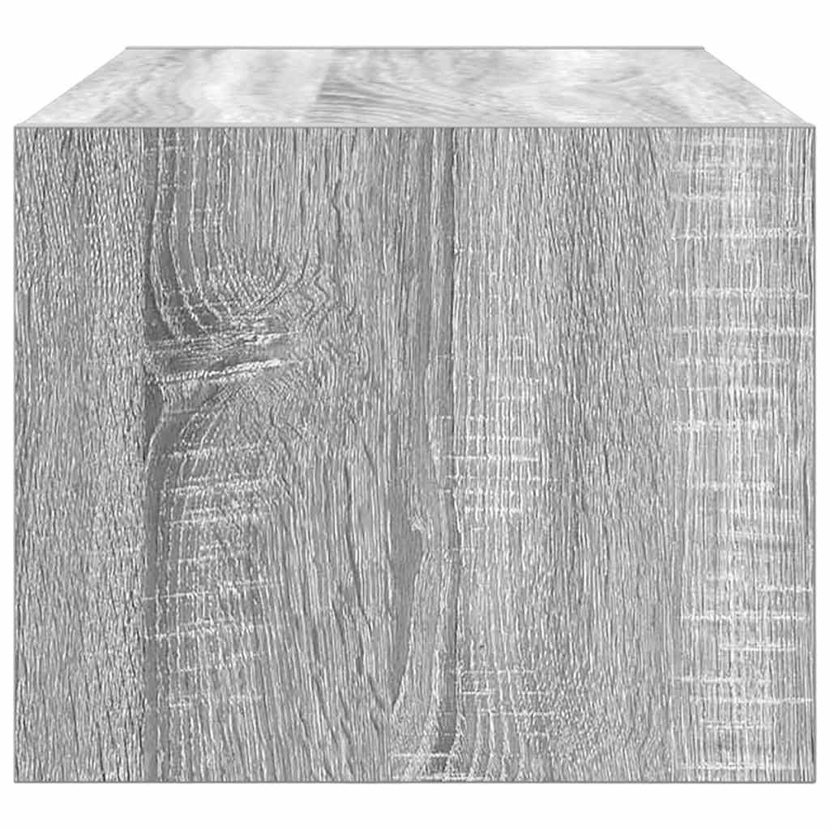 Nahaufnahme eines grauen Holzblocks. Die Holzmaserung ist sichtbar. Der Block hat eine rechteckige Form. Die Kanten sind sauber.