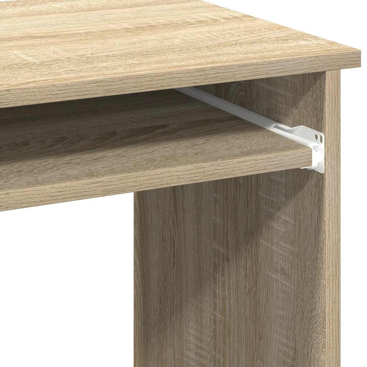 Nahaufnahme eines Holzschreibtisches mit ausziehbarer Tastaturablage. Weiße Metallhalterungen und Holzmaserung sind sichtbar.