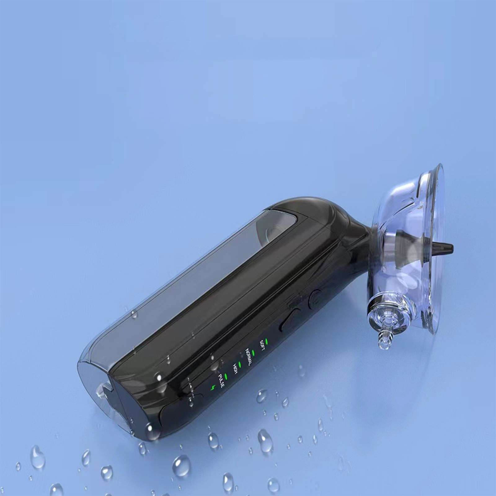 Ein schwarzes und transparentes medizinisches Gerät auf einer blauen Oberfläche. Es hat Anzeigen und einen Saugnapf am Ende.